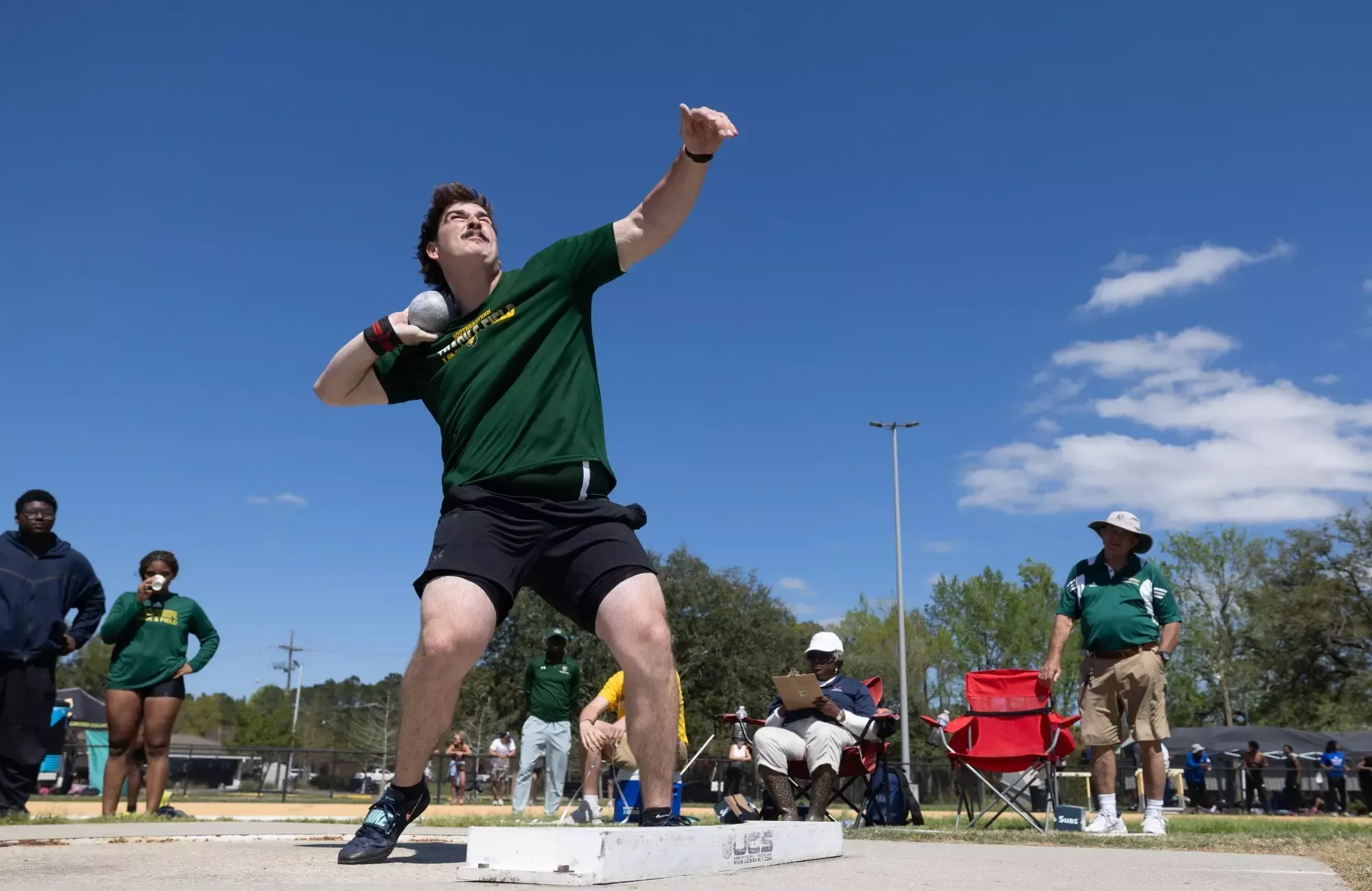 Porter Gibson throws the shot put at the Andy Thiel Season Opener