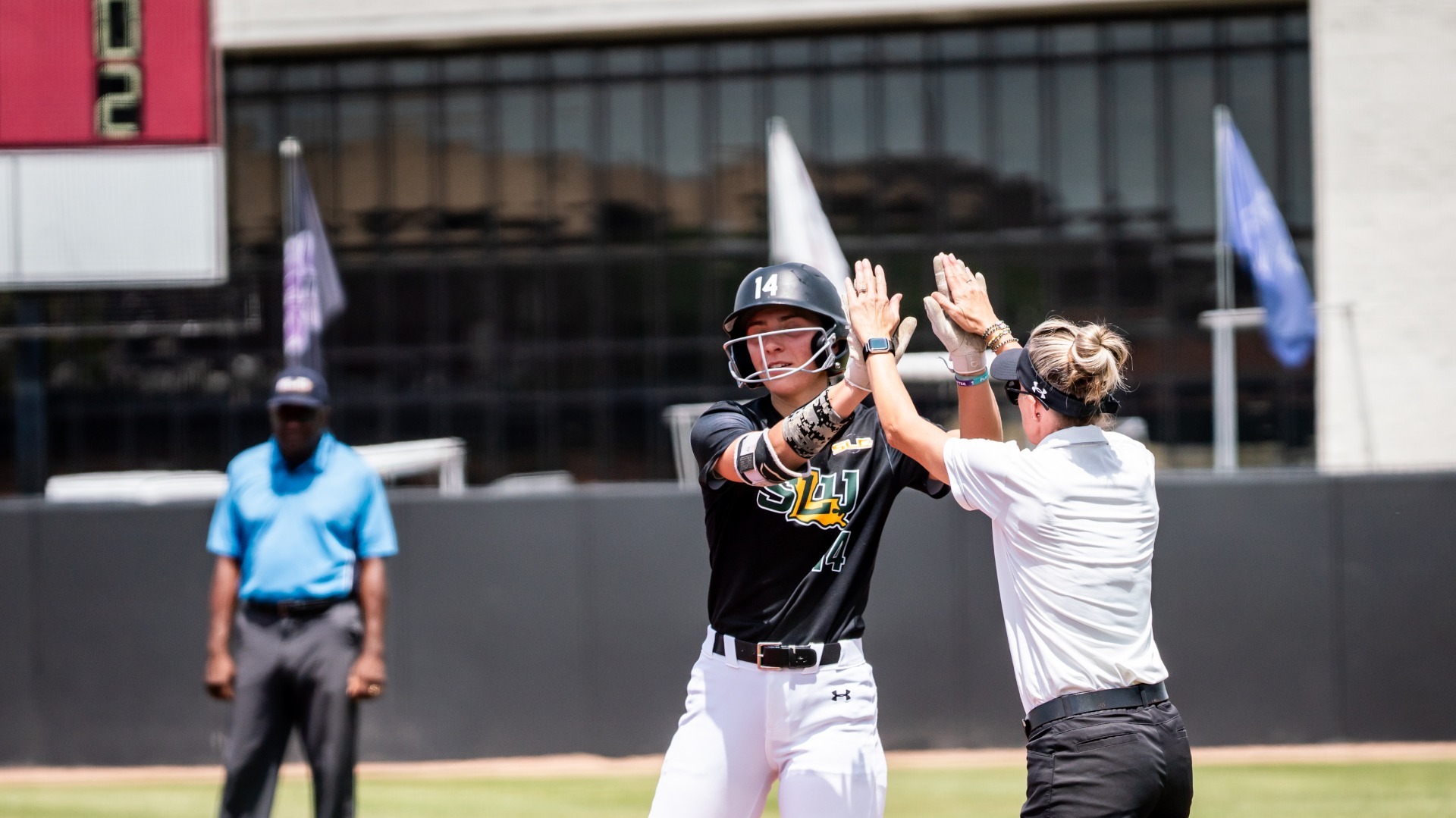 Cydnee Schneider and Assistant Coach Alana Fremin celebrate one of Schneider's four hits at Nicholls April 18, 2026
