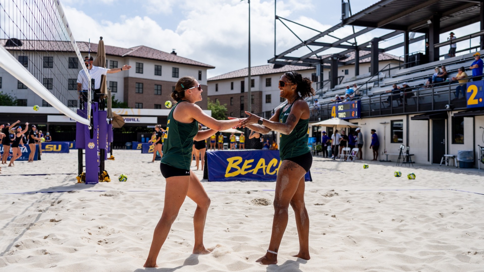 Makayla Hicks and Cadie Kusy high fiving each other after a celebration in Baton Rouge, La.