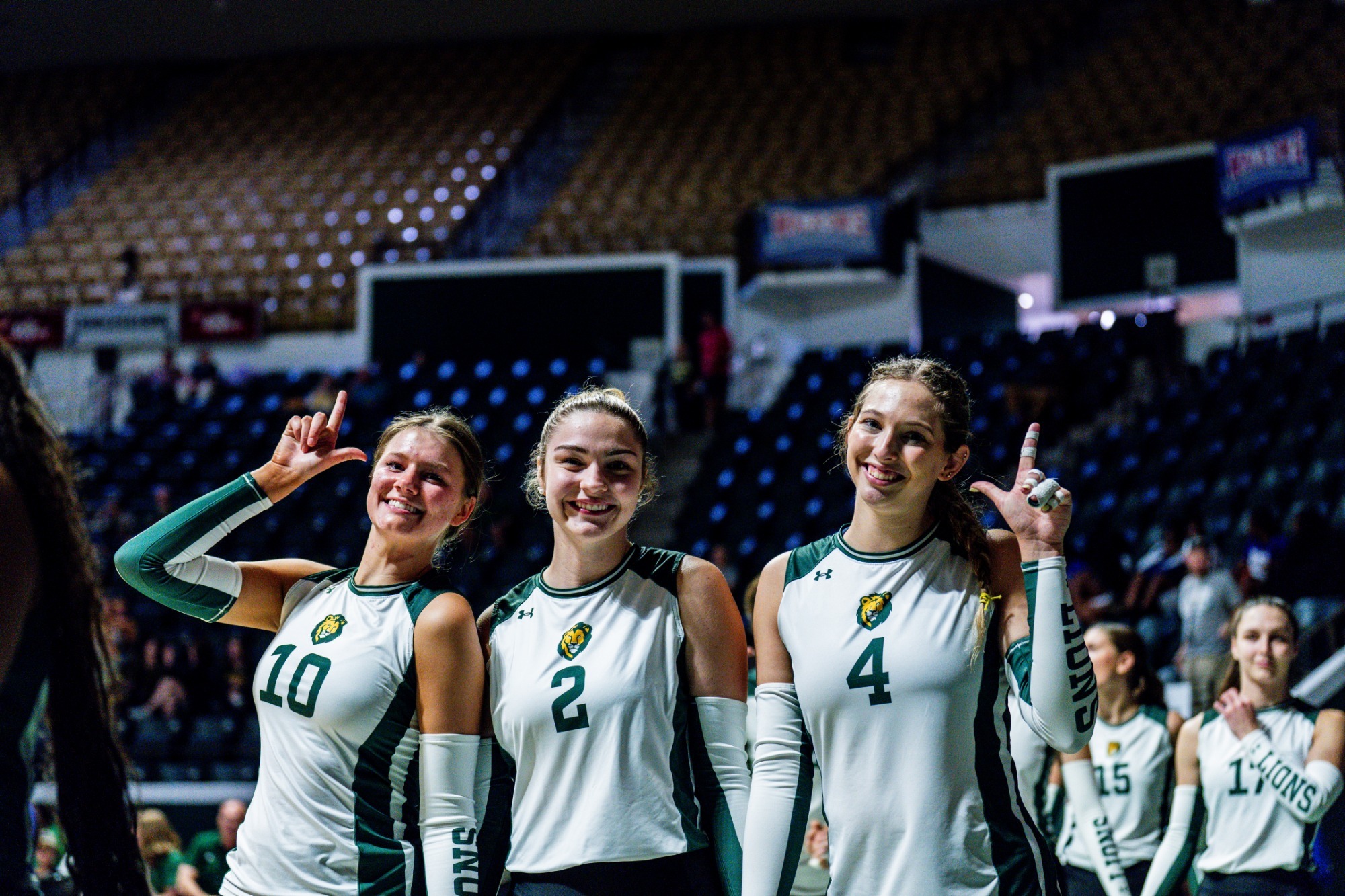 Gracie Brown, Abigail Bailey, and Ainsley Driska walk on the University Center court vs. McNeese