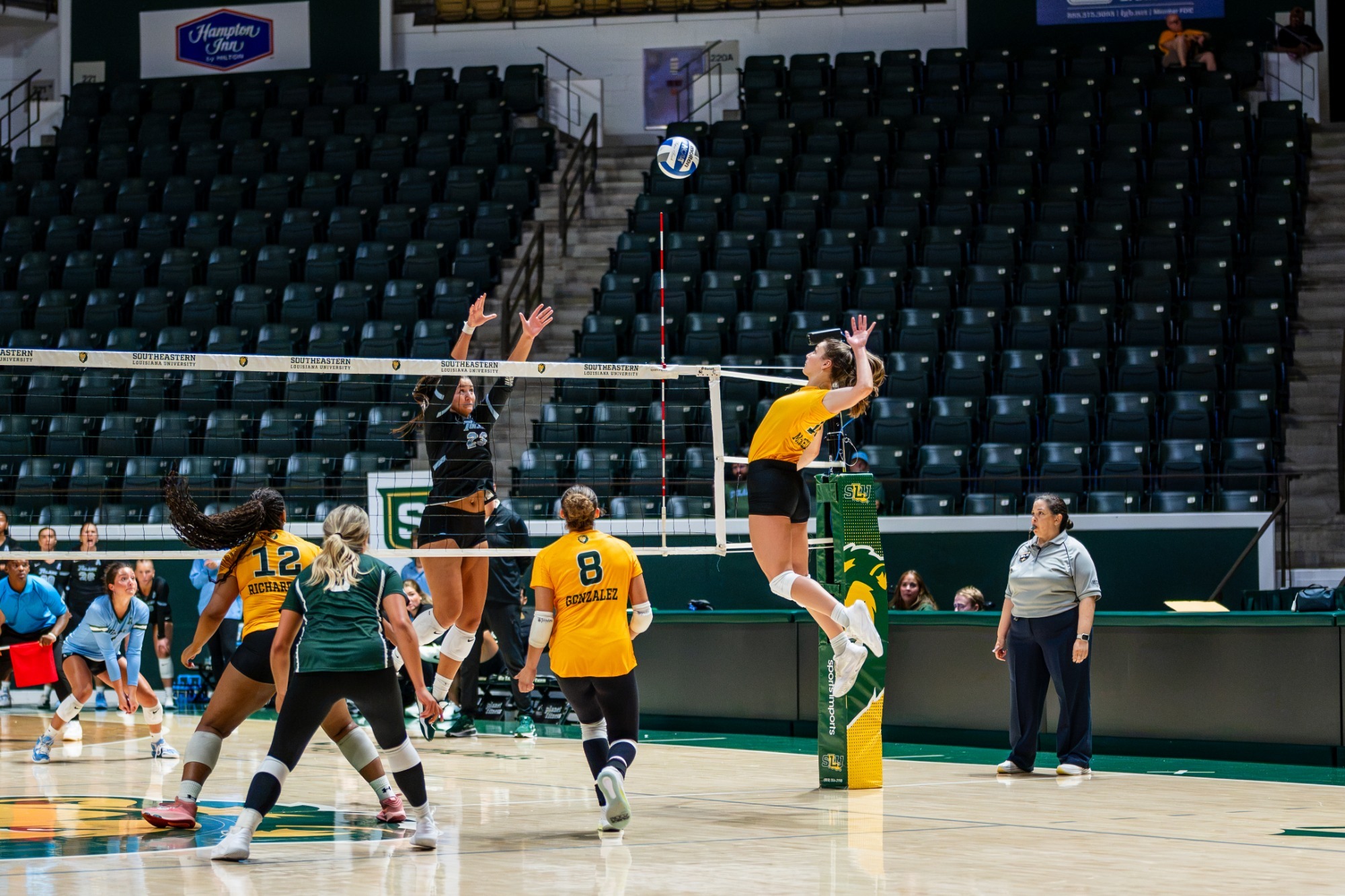 Kyra McKelvey takes a swing for a kill in the Tulane exhibition match in the University Center