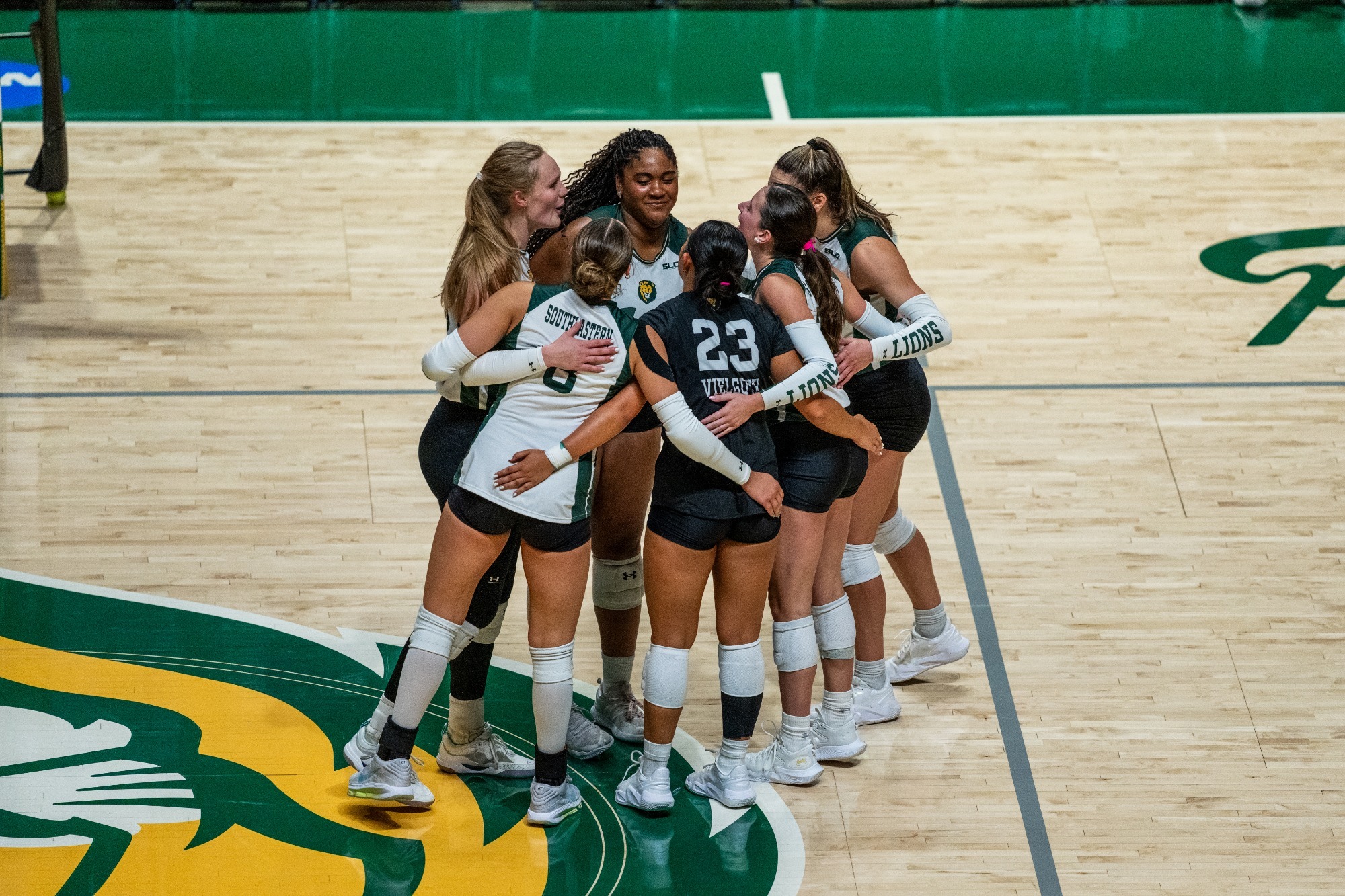 SLU huddles up after a point in the University Center