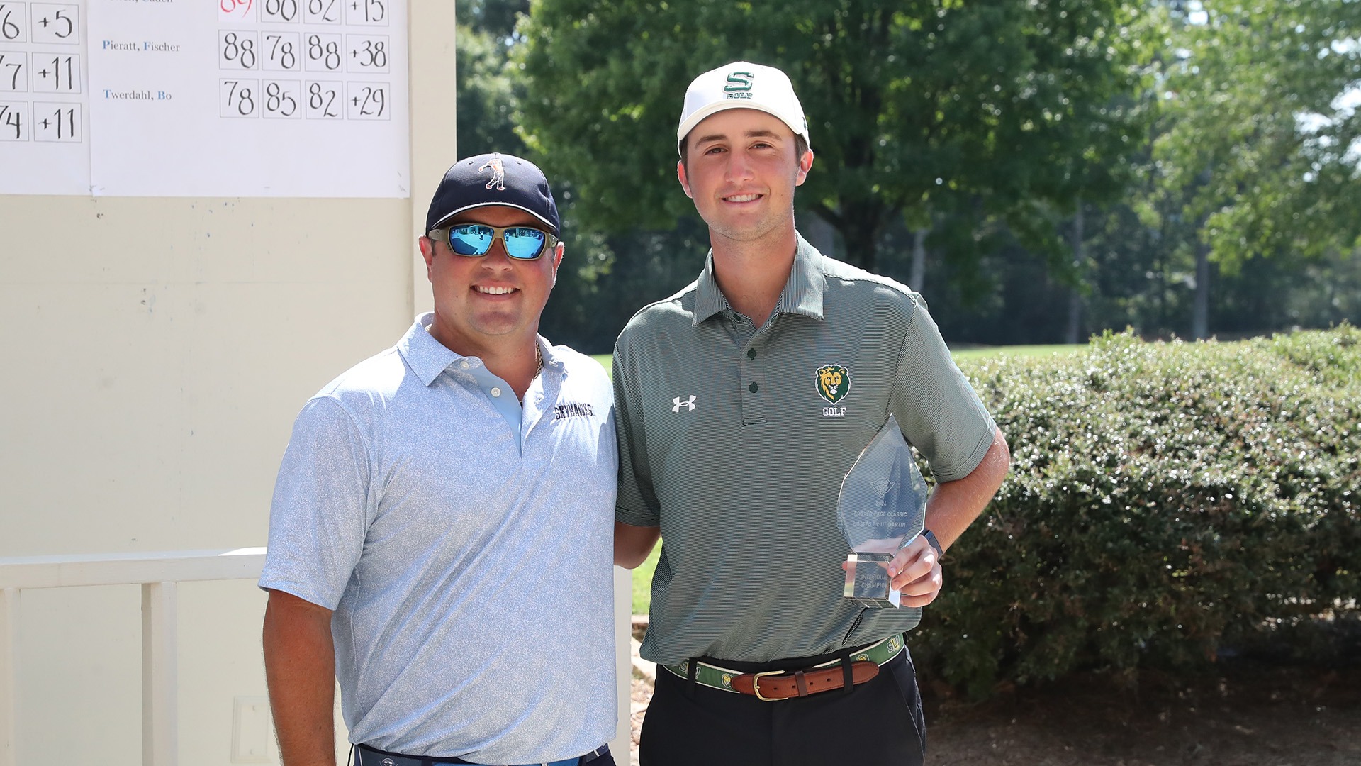 UT Martin head golf coach Austin Swafford (left) presents 2026 Grover Page Classic individual medalist trophy to David Marsh (right)
