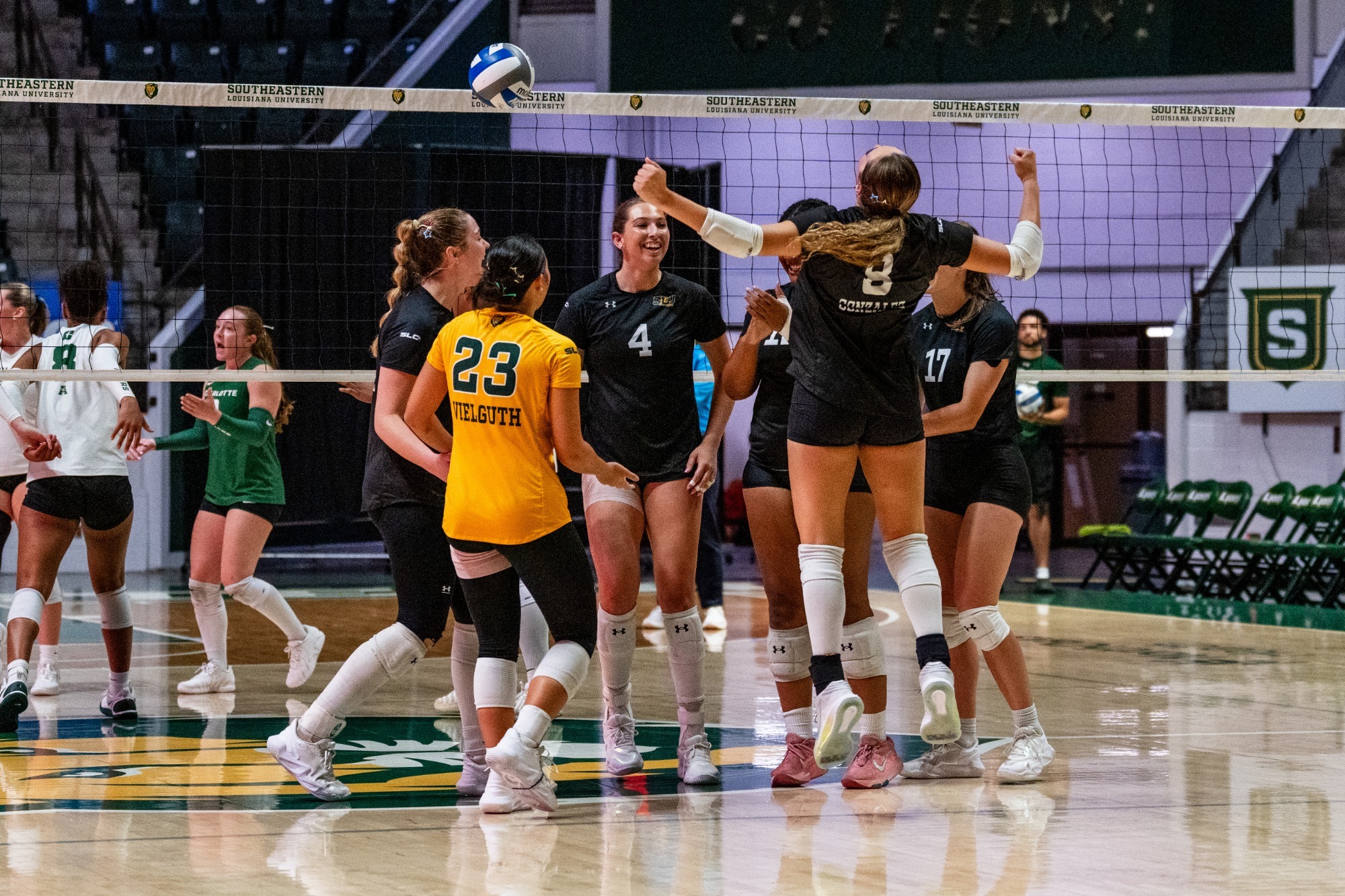 The Lions celebrate in the University Center