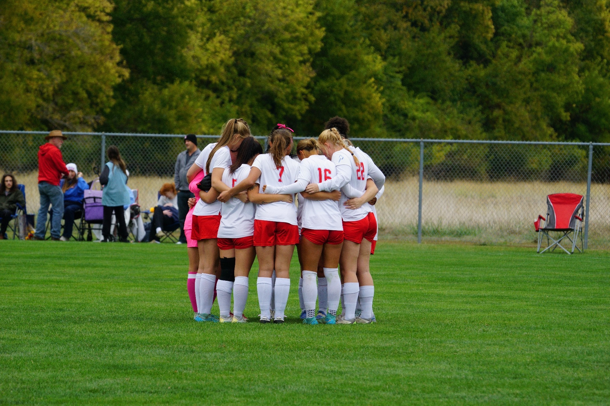 LLCC women's soccer team standing.