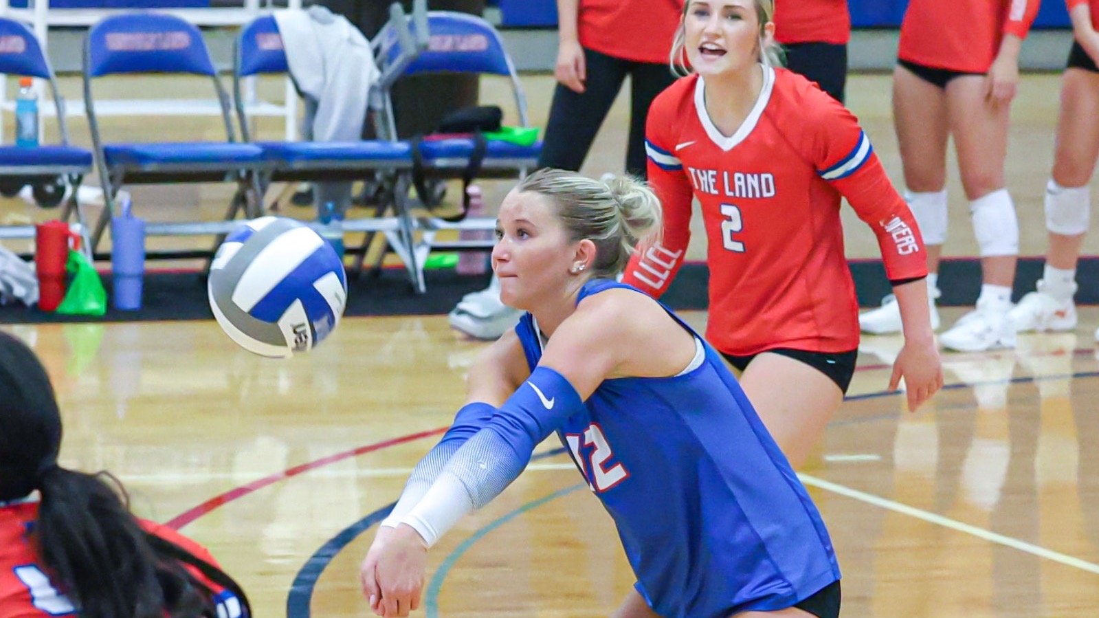 LLCC volleyball playing volleyball.