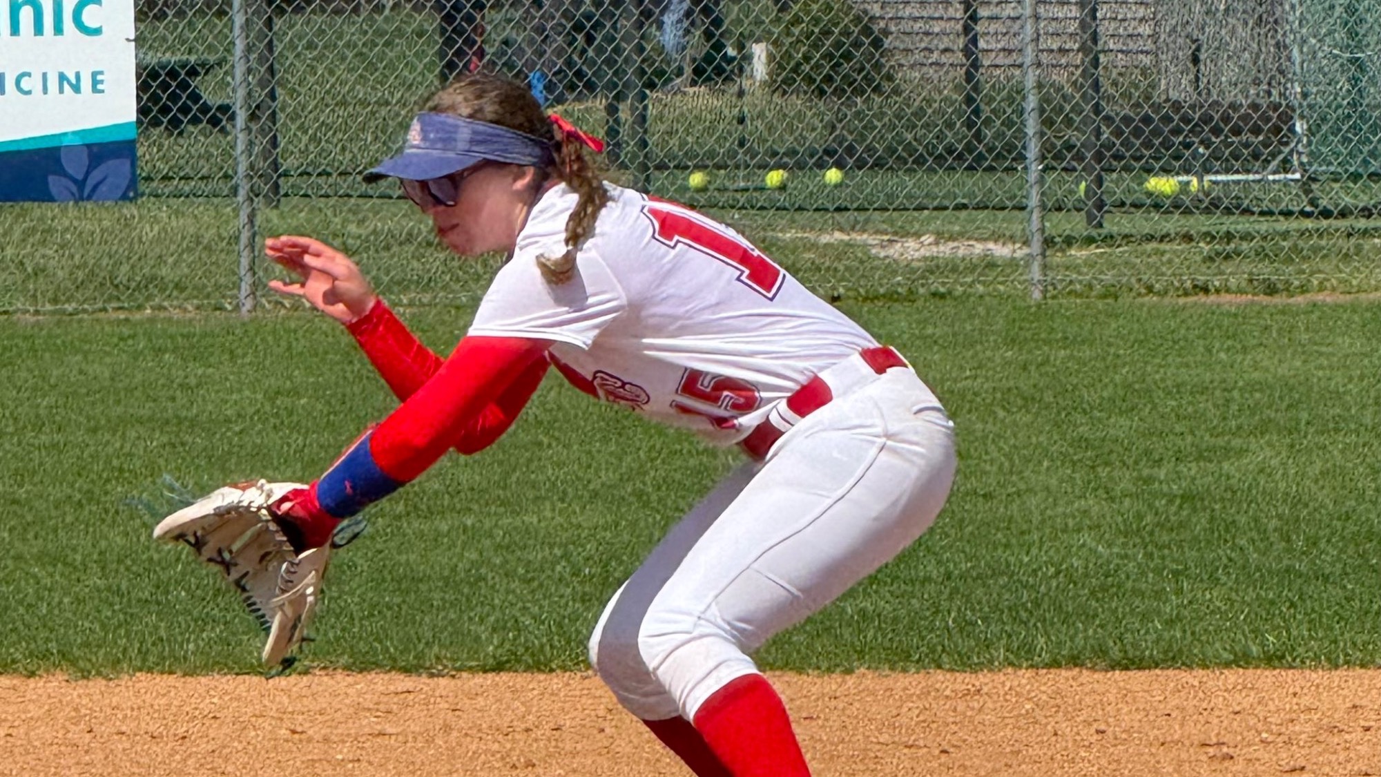LLCC softball player getting ready to field a ball.