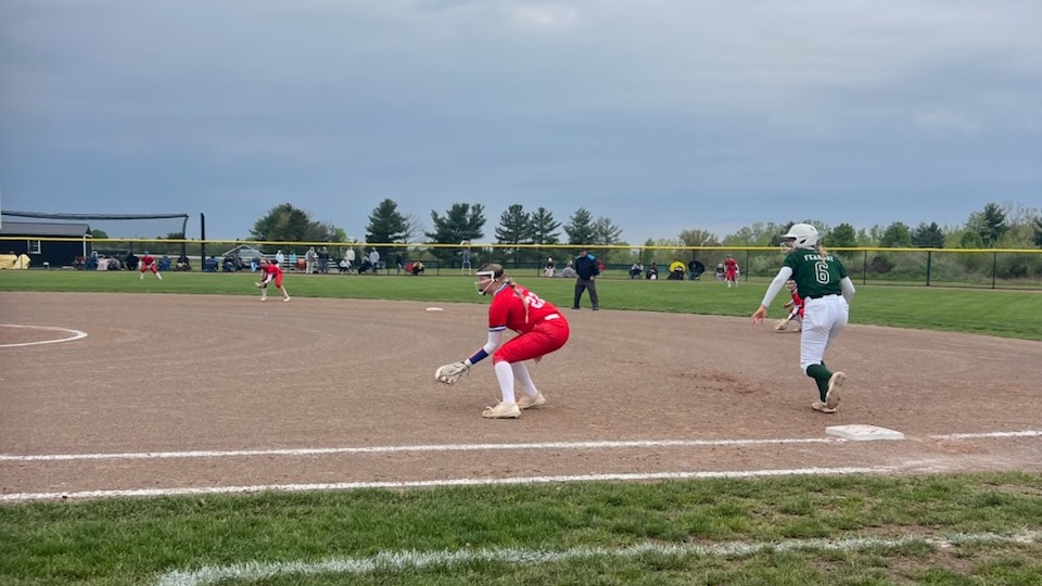 LLCC softball player fielding.