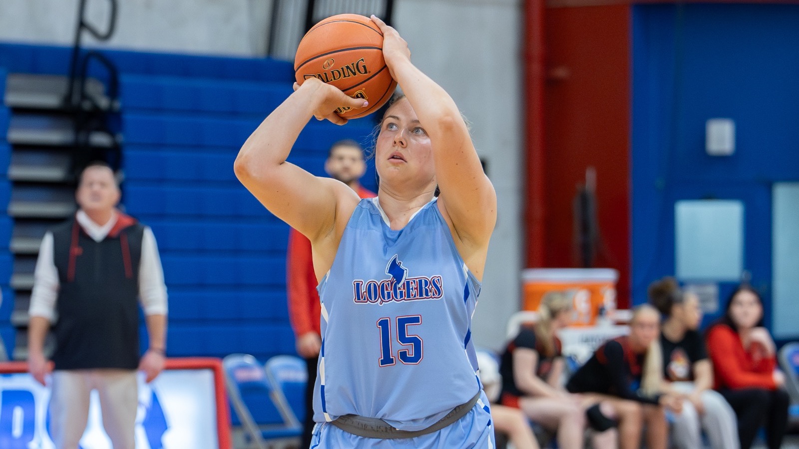 LLCC women's basketball player shooting a basketball.