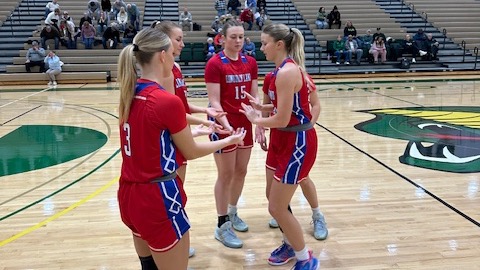 LLCC women's basketball team in a circle. 