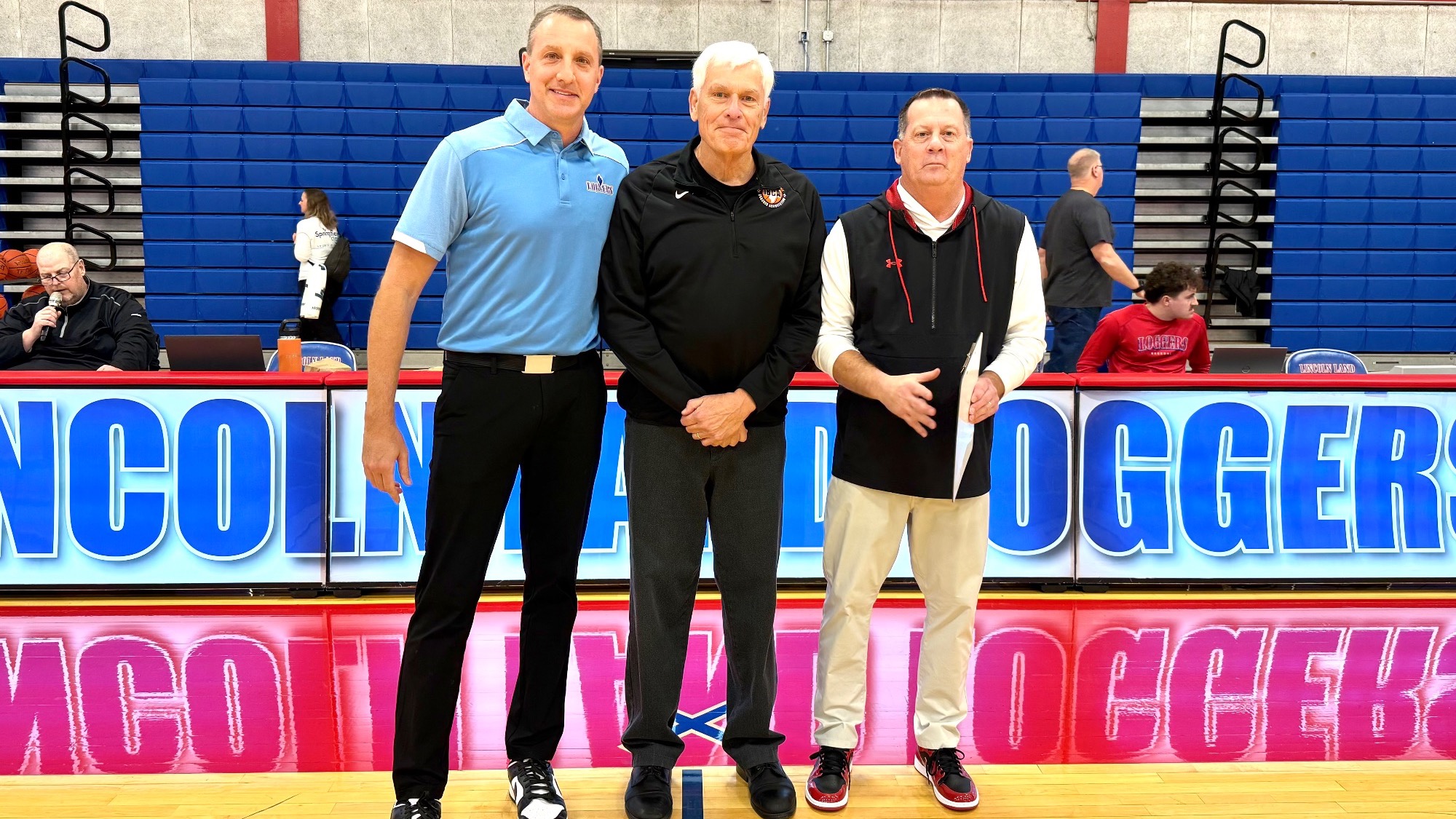Coach Jones and Johnson standing together.