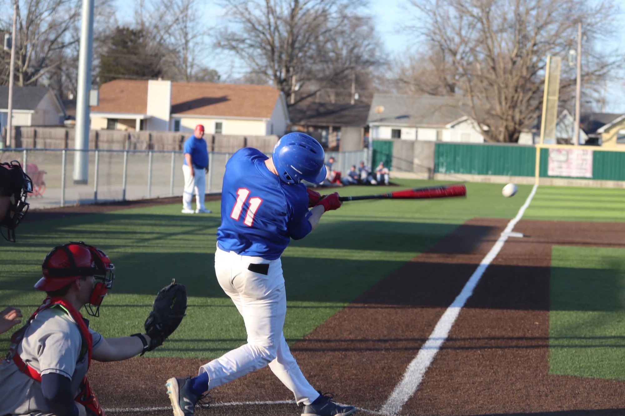 LLCC baseball player hitting a ball.