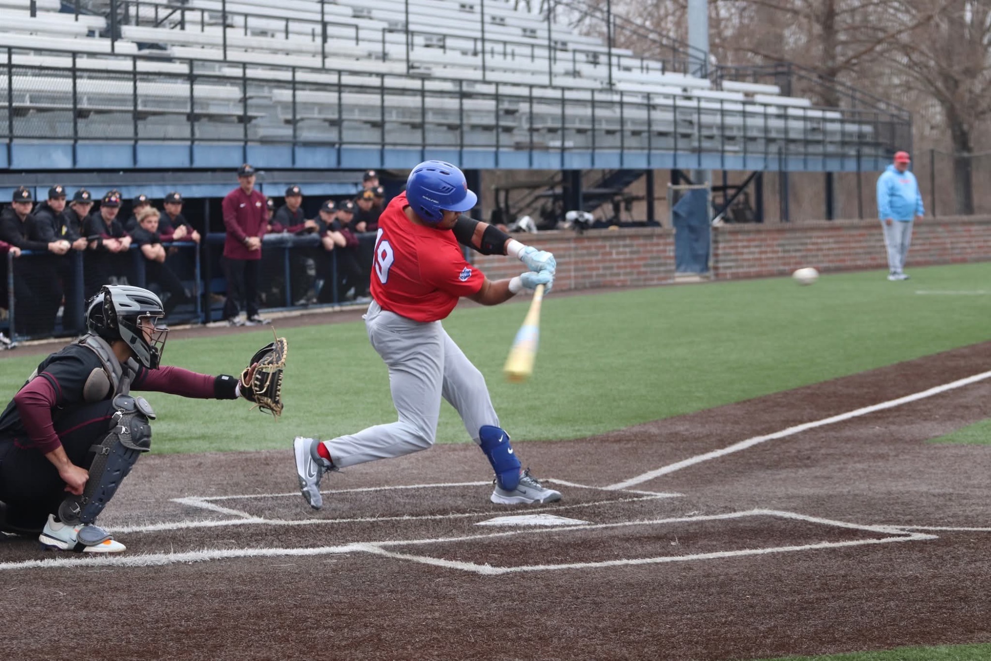 LLCC baseball player hitting a ball.