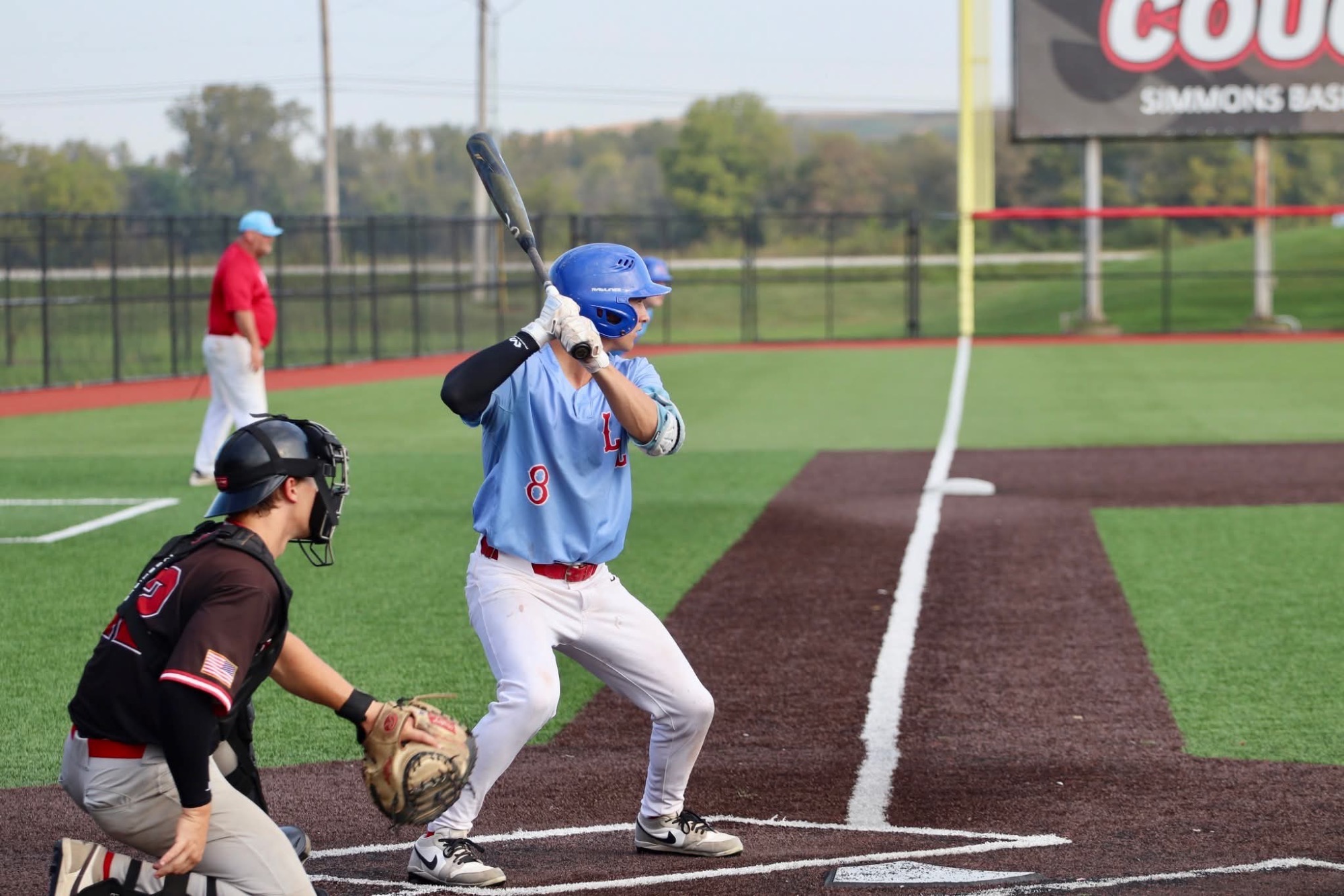 LLCC baseball player hitting.