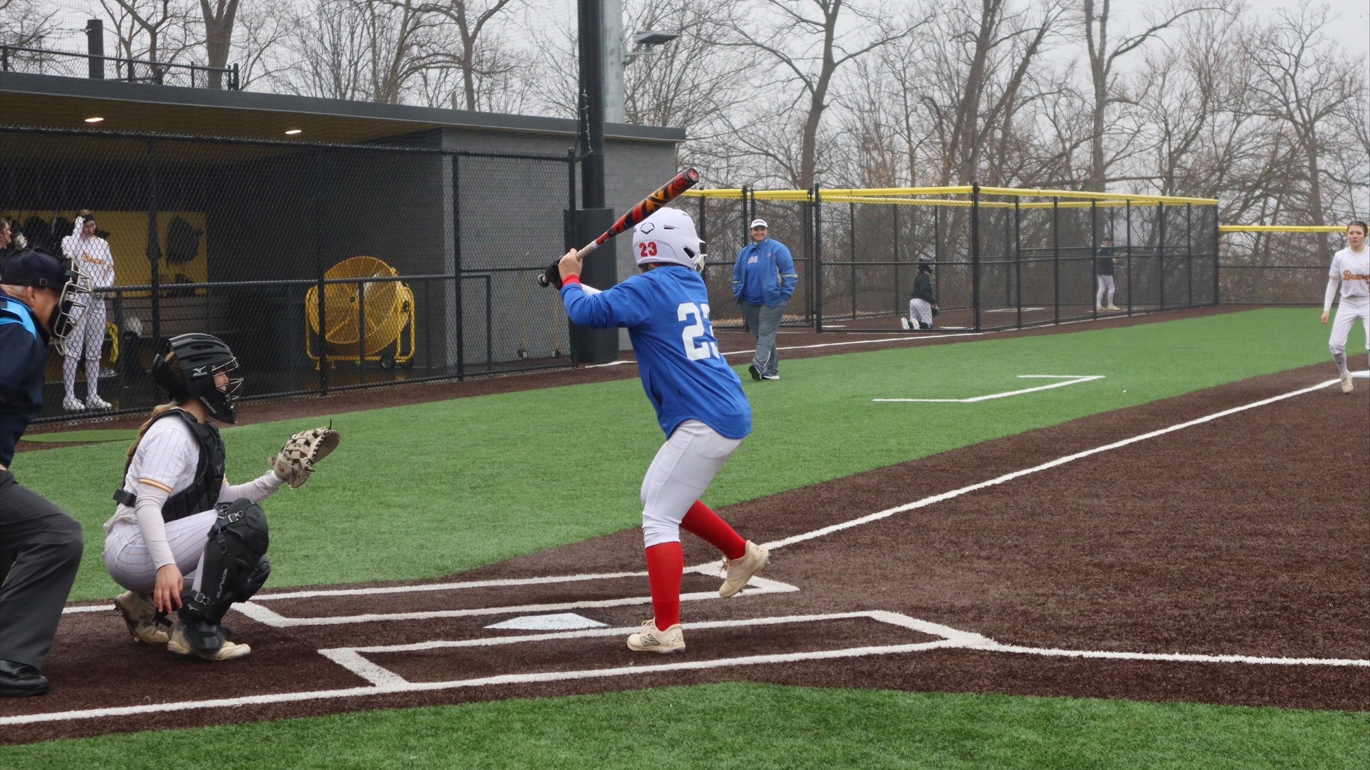 LLCC softball player hitting a ball.