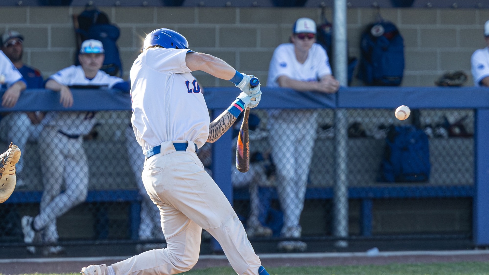 LLCC baseball player hitting.