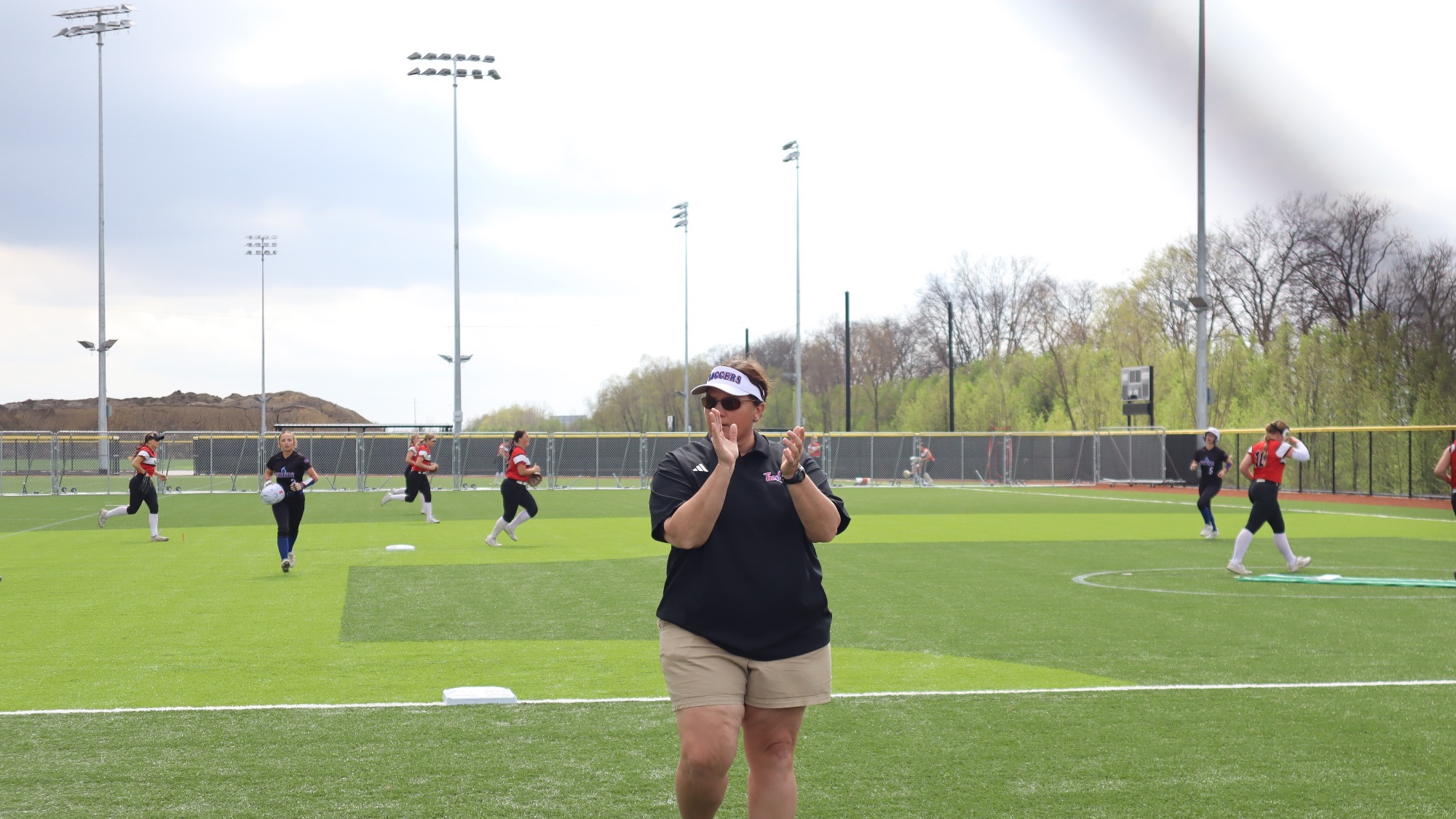 LLCC softball coach cheering.