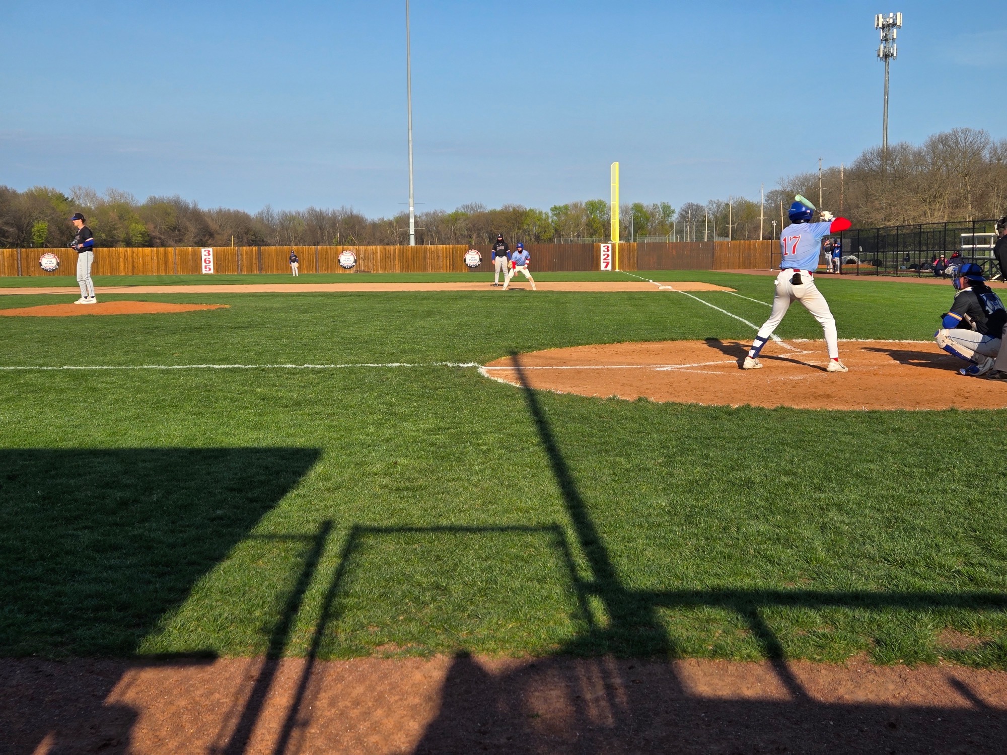 LLCC baseball player hitting a baseball.