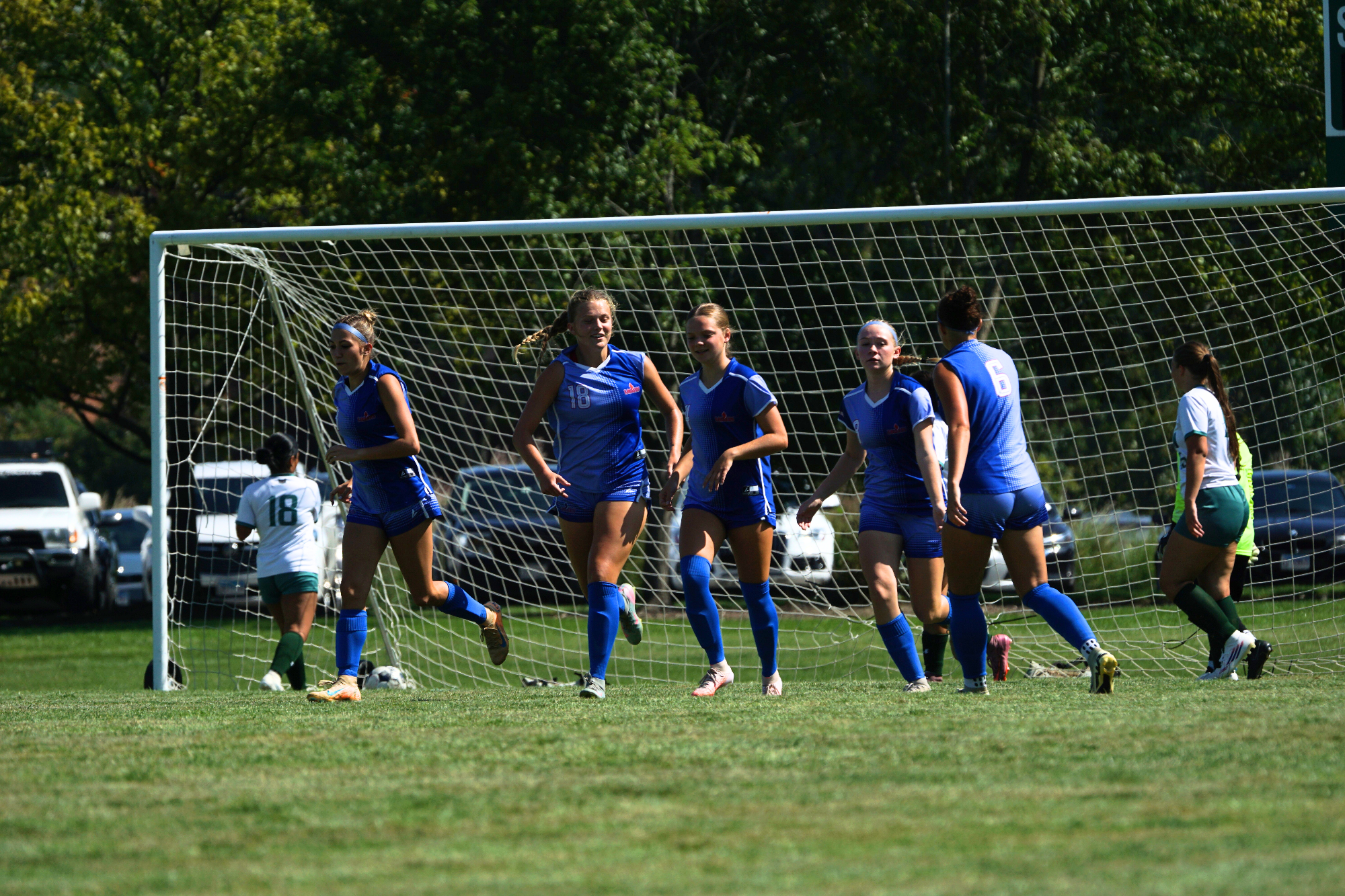 LLCC women's soccer team running.