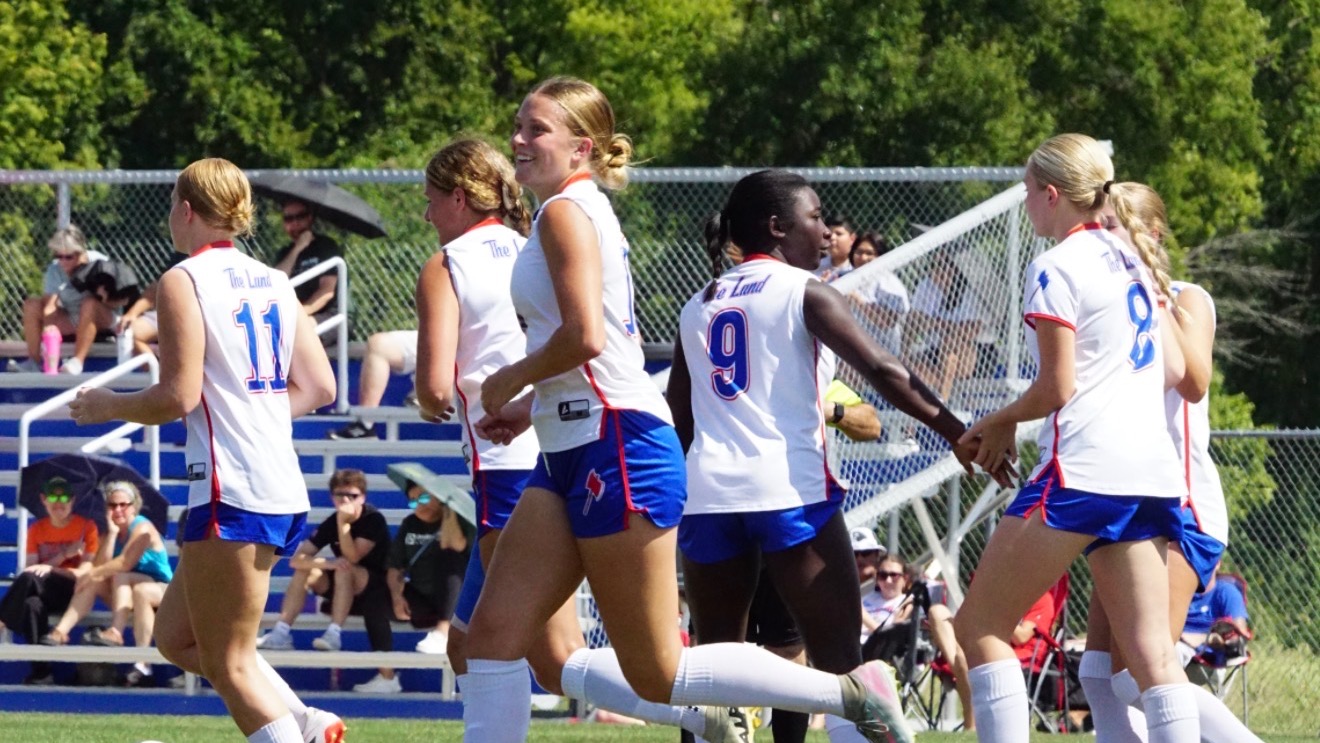 LLCC soccer team celebrates.