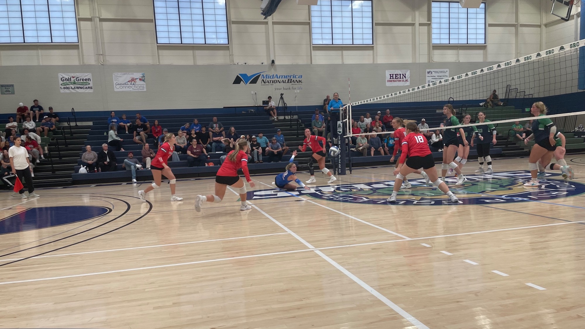 LLCC volleyball playing volleyball.