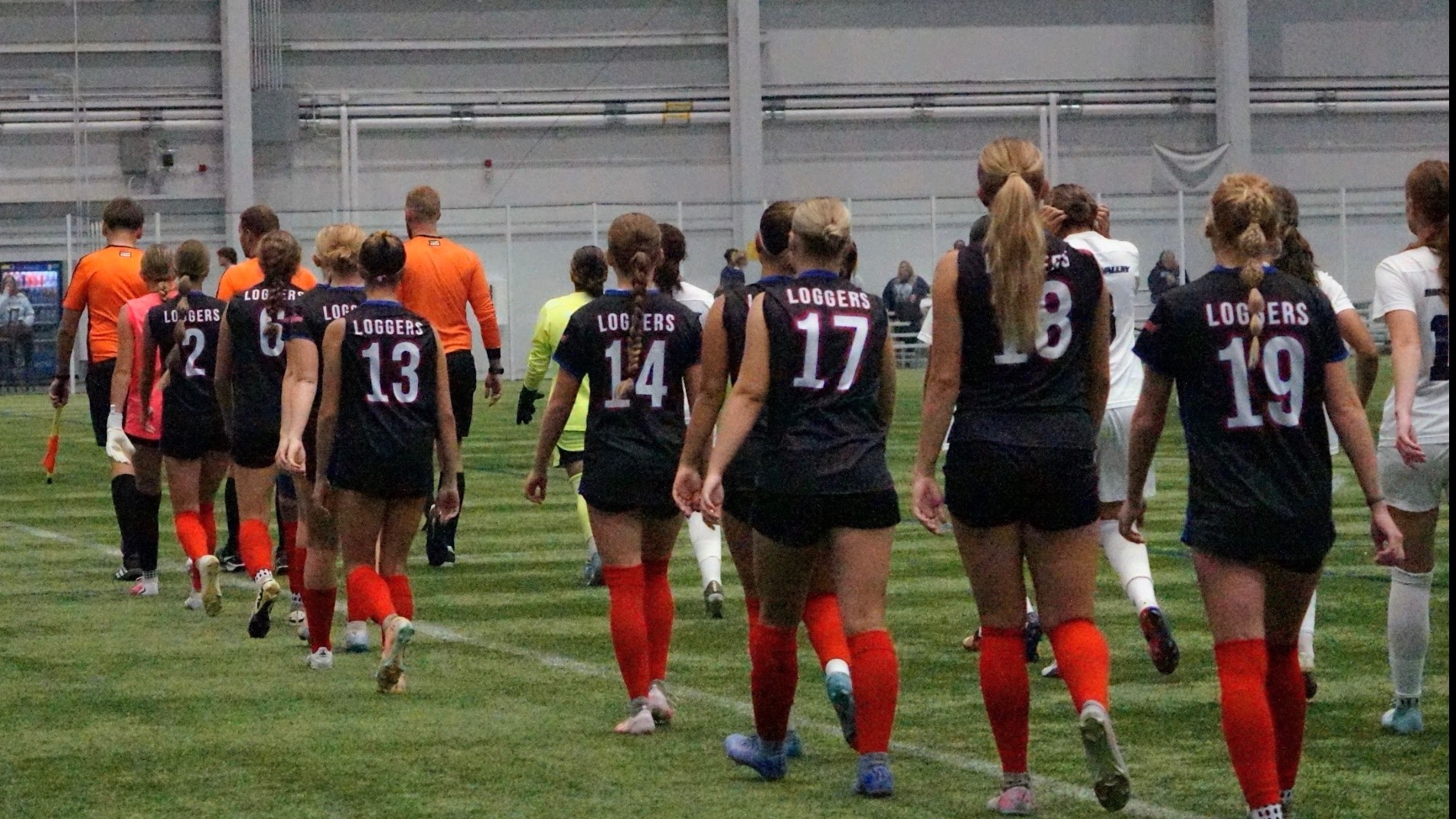 LLCC women's soccer team walking.