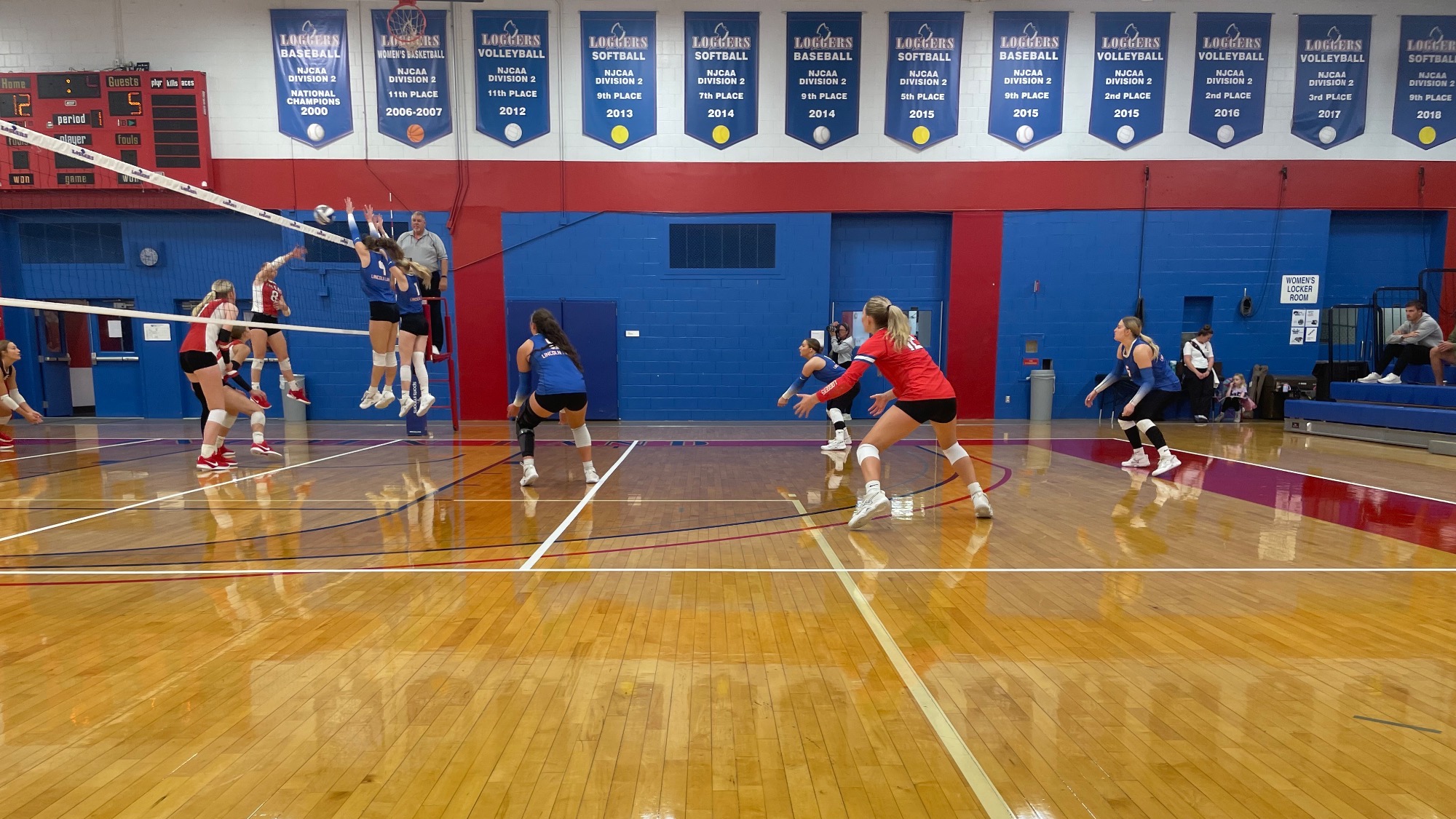 LLCC women's volleyball team playing volleyball.