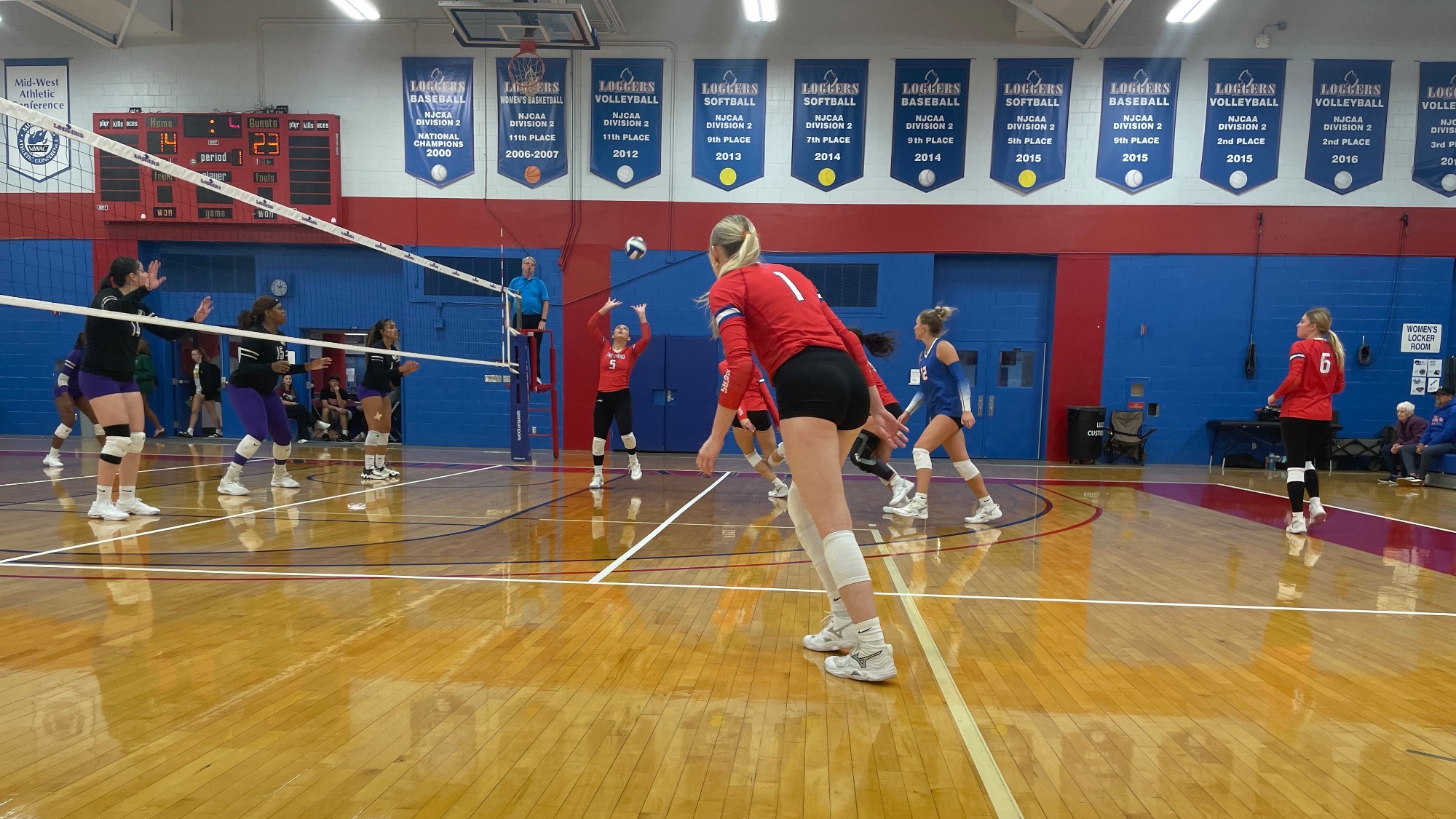 LLCC women's volleyball team playing volleyball.