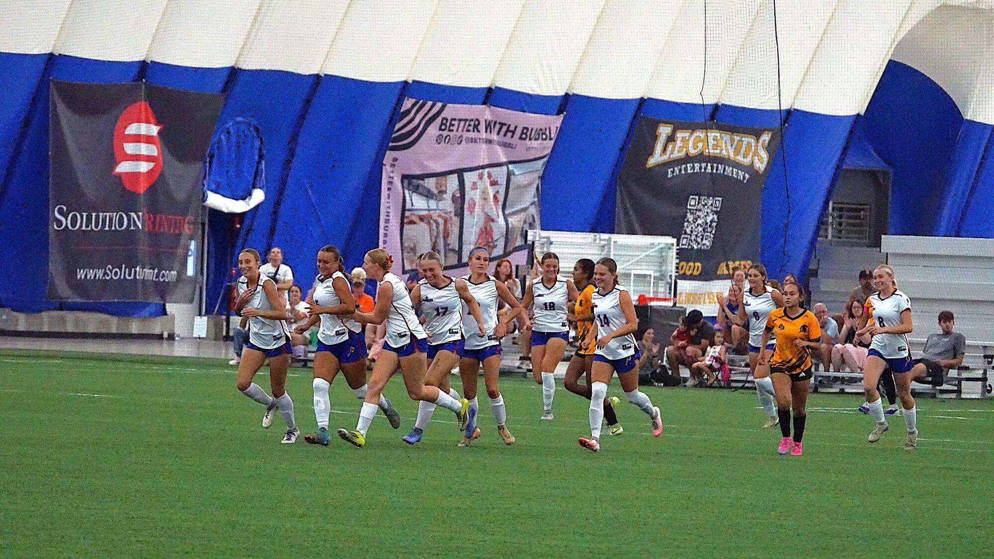 LLCC women's soccer team cheering.