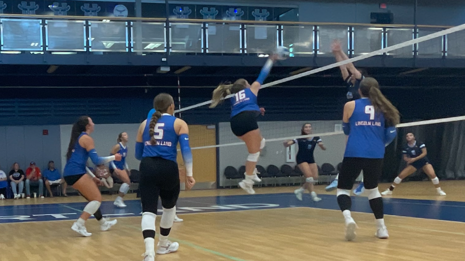 LLCC volleyball team playing volleyball.