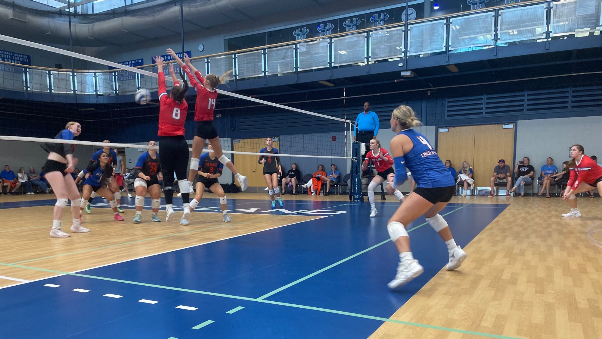 LLCC volleyball players playing volleyball.