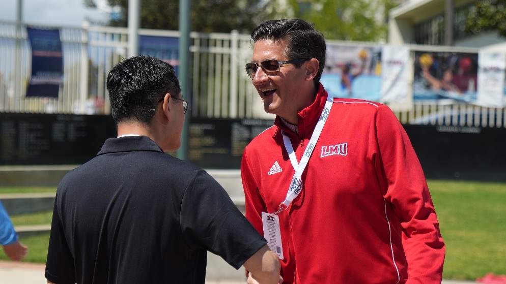 Craig Pintens Athletic Director with President Thomas Poon - 2025 GCC Women's Water Polo Tournament