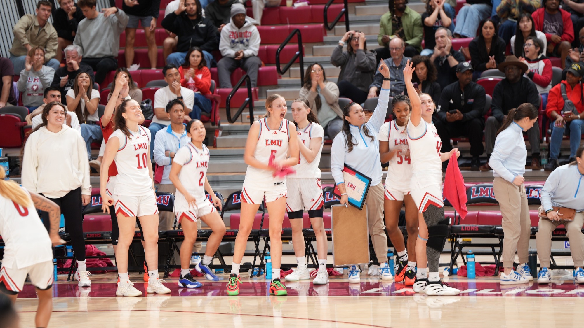 WBB Bench hyped for a 3