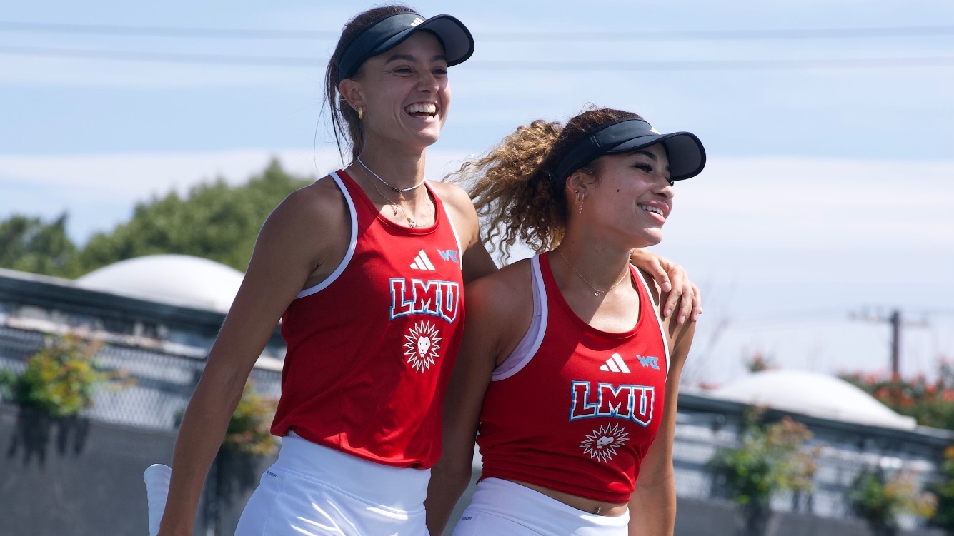 Lidia and Camilia celebrate after doubles win