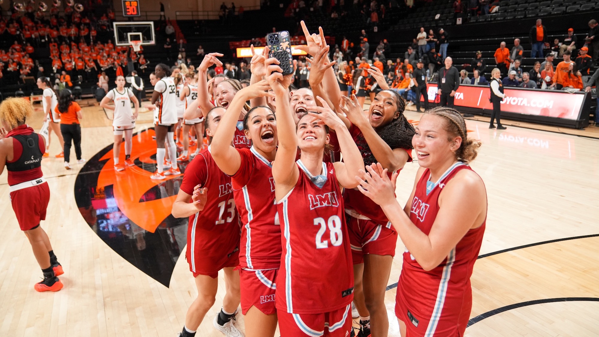 WBB Celebrating Center Court as Reg Season WCC Champions