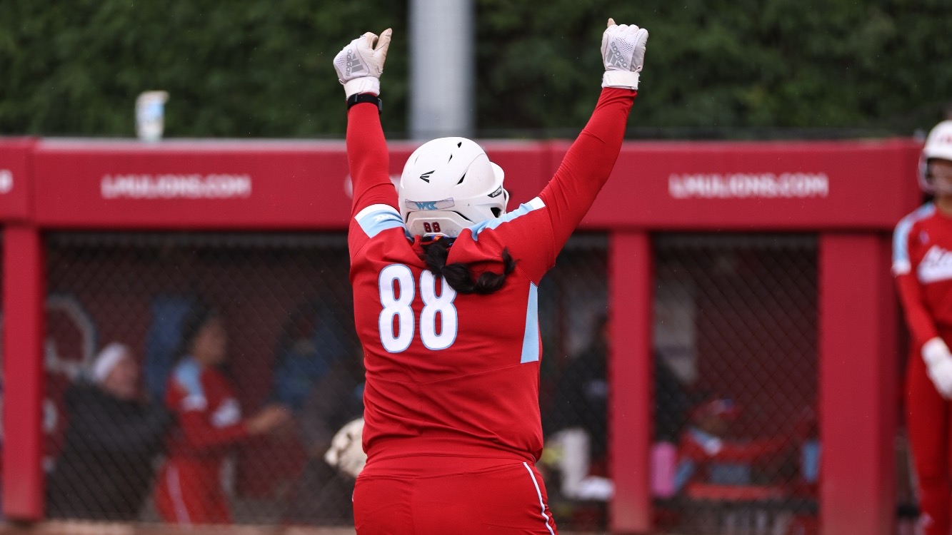 Izzy Jamgotchian running home cheering with arms up