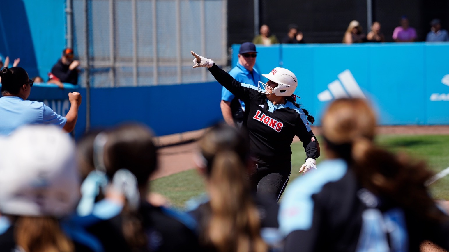 Izzy Jamgotchian running home in her walk-off 3-run homer