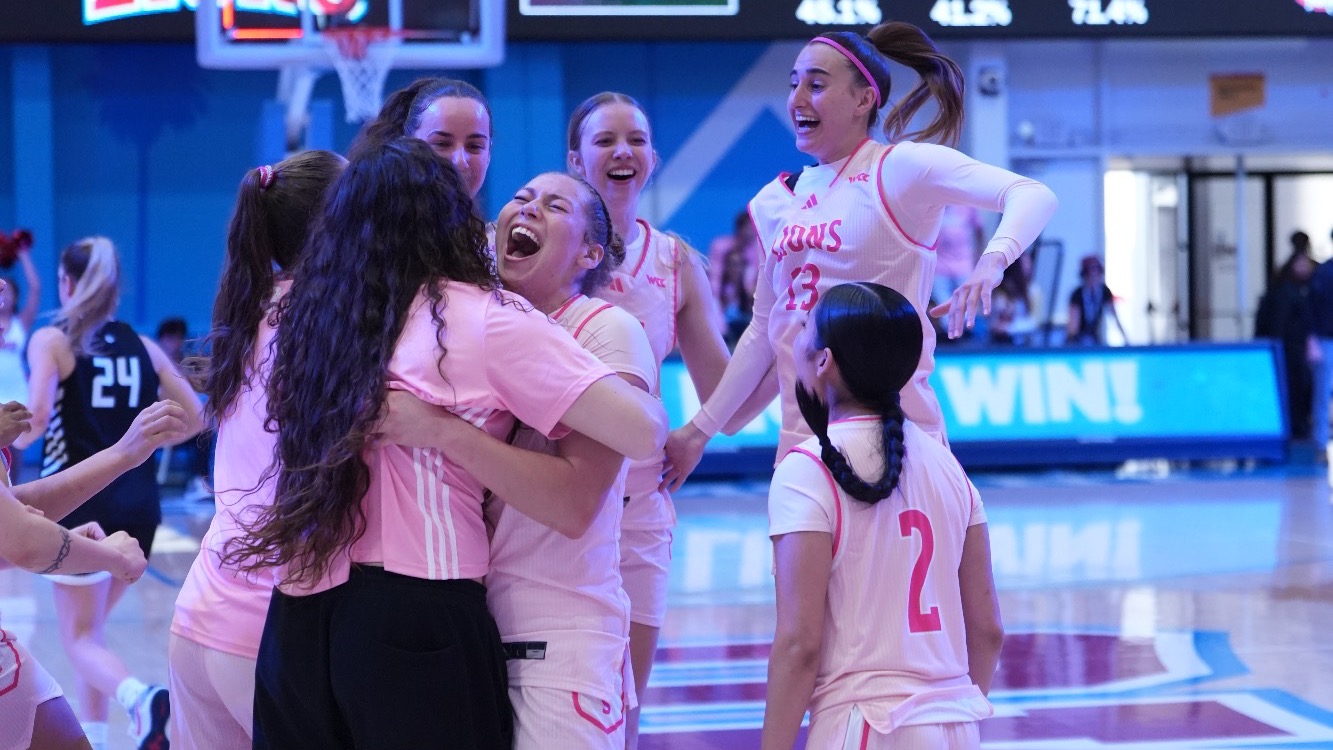 WBB Team Celebrating at Half Court