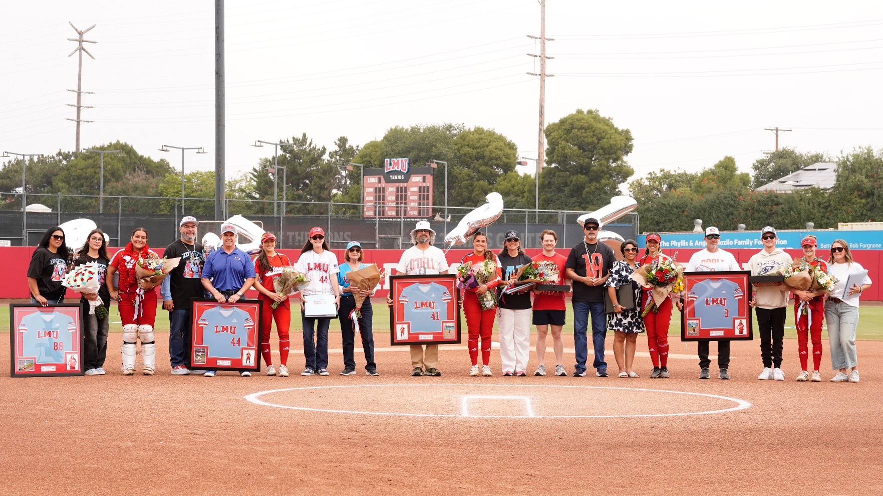 Softball Senior Day with families on the field