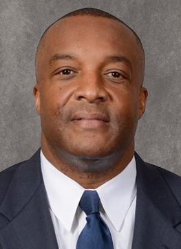 Ron Cooper headshot photo shopped background 