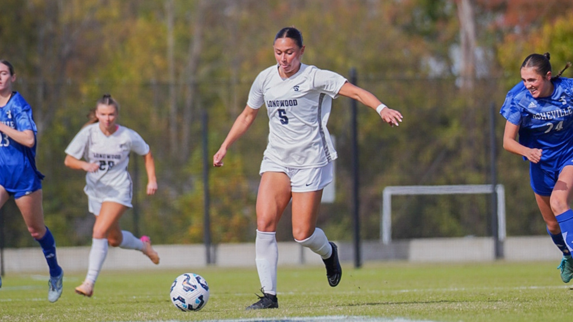 Peyton Curney dribbling ball against UNC Asheville in 2-0 win