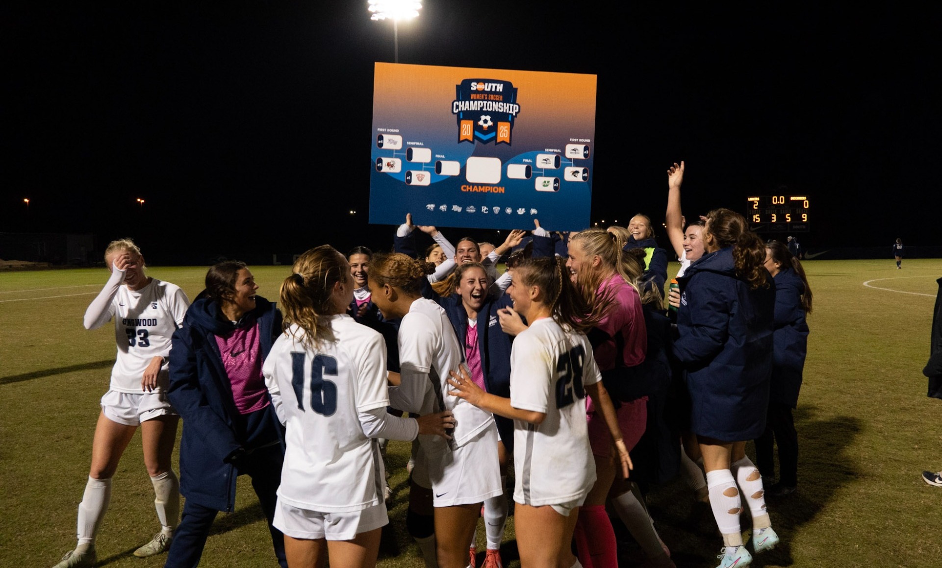 WSOC holding up stamped bracket - moving to the Big South semi-finals