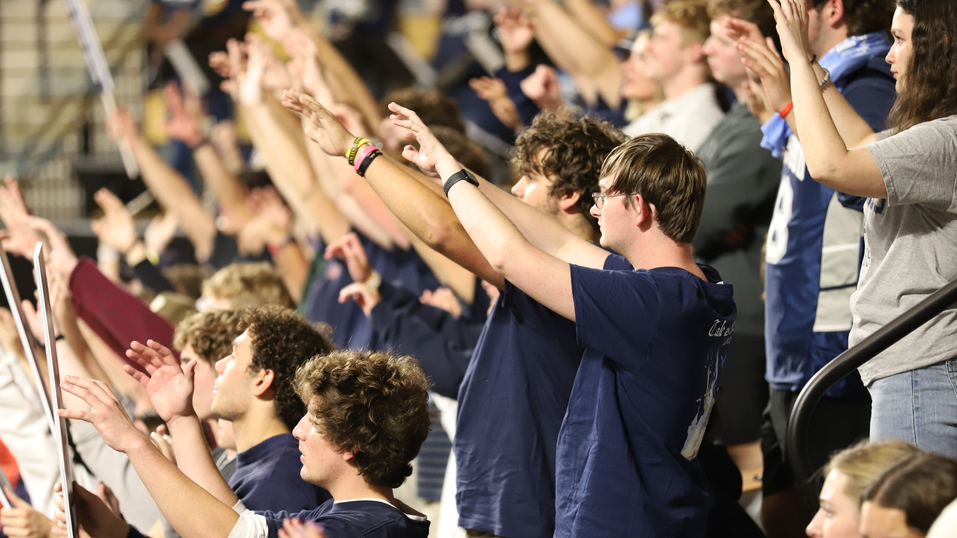 Fans at JPB cheer at a basketball game