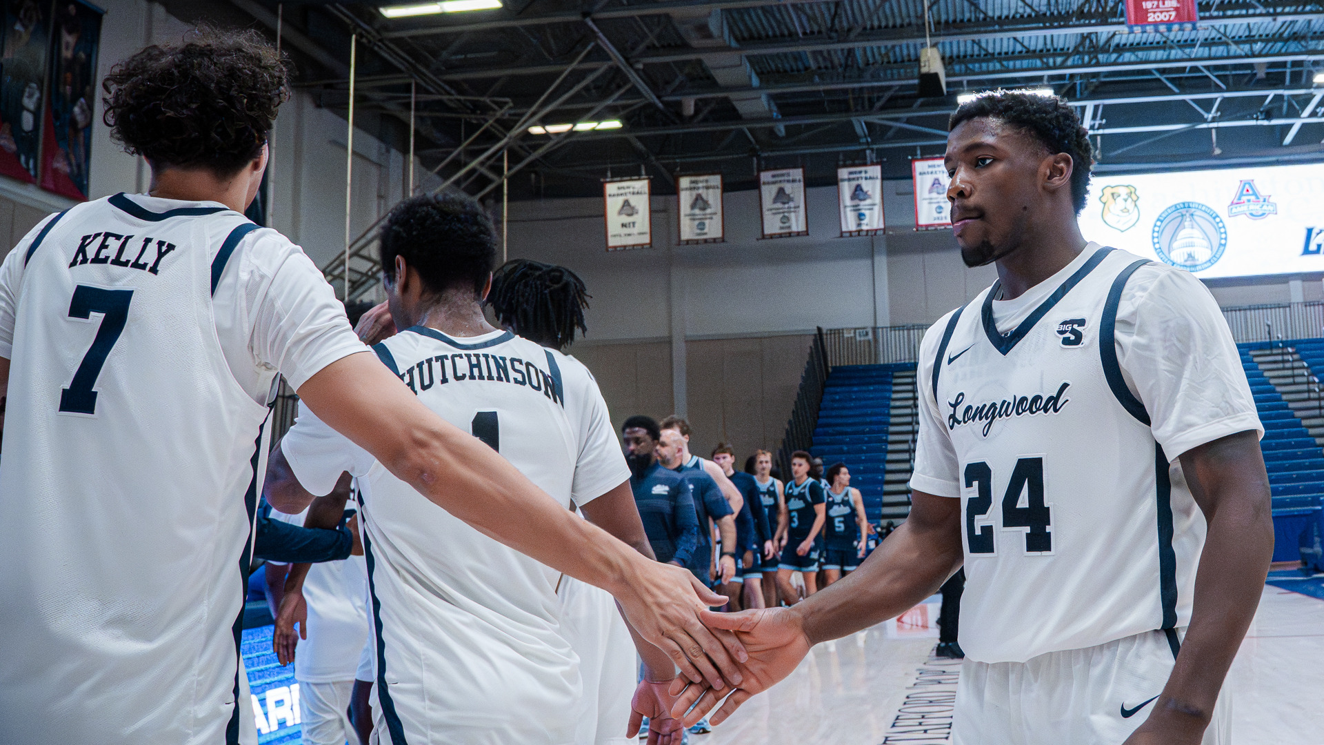 Jaylen Benard low-fives Elijah Kelly