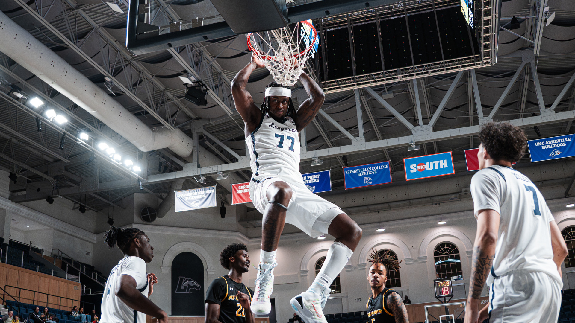 Elijah Tucker dunks the basketball