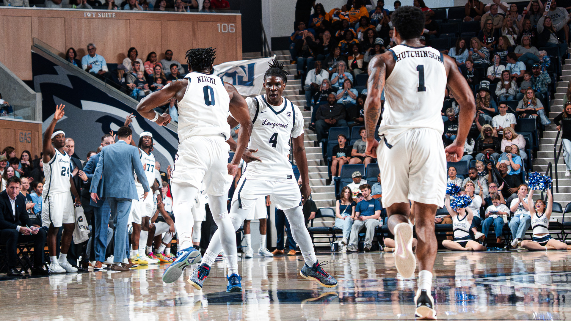 Emanuel Richards high fives Johan Nziemi