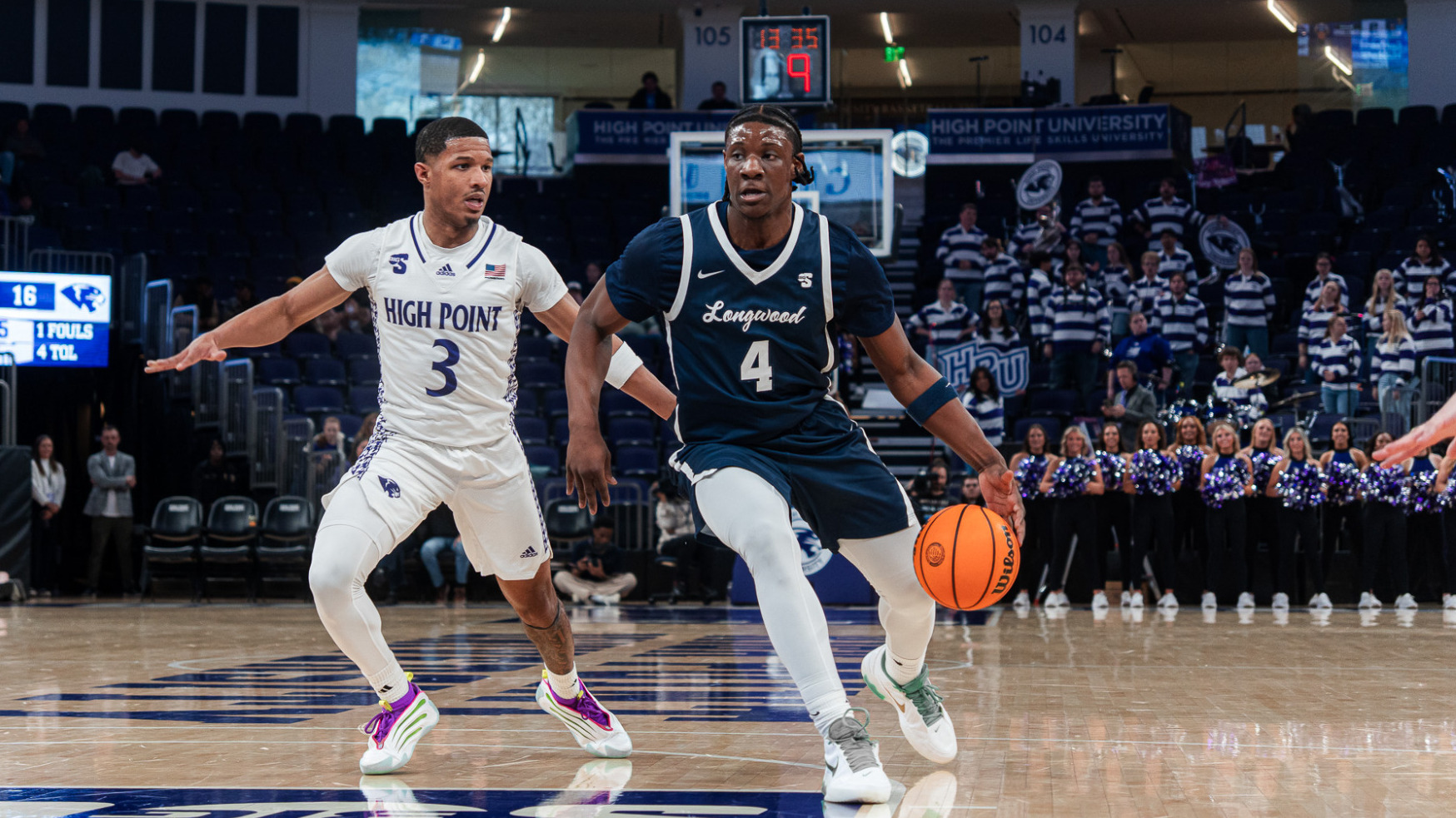 Emanuel Richards drives the basketball