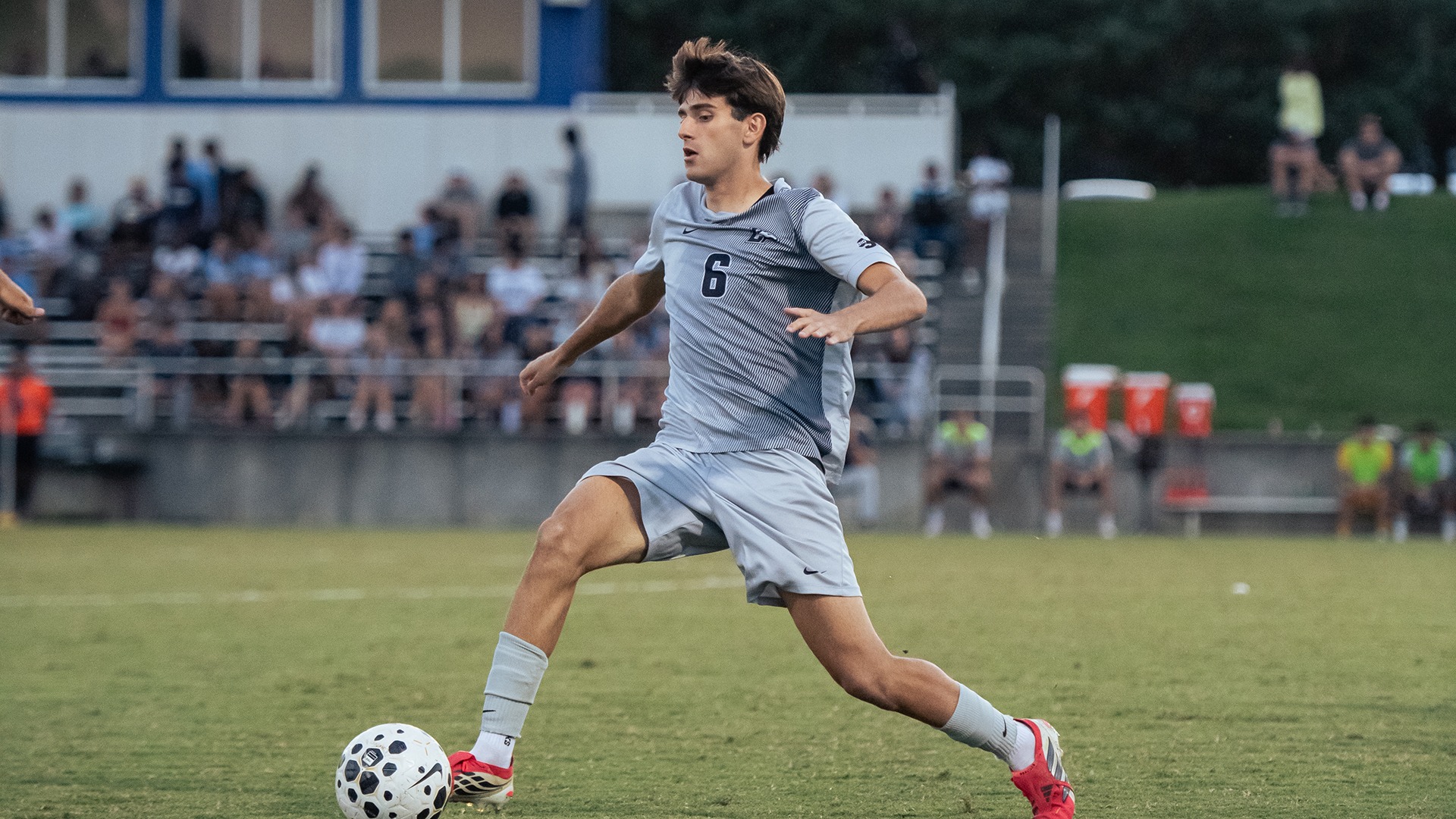 Pau Garcia lunges to stop a pass in the midfield during Longwood's home match with Navy on Sept. 15, 2026. 