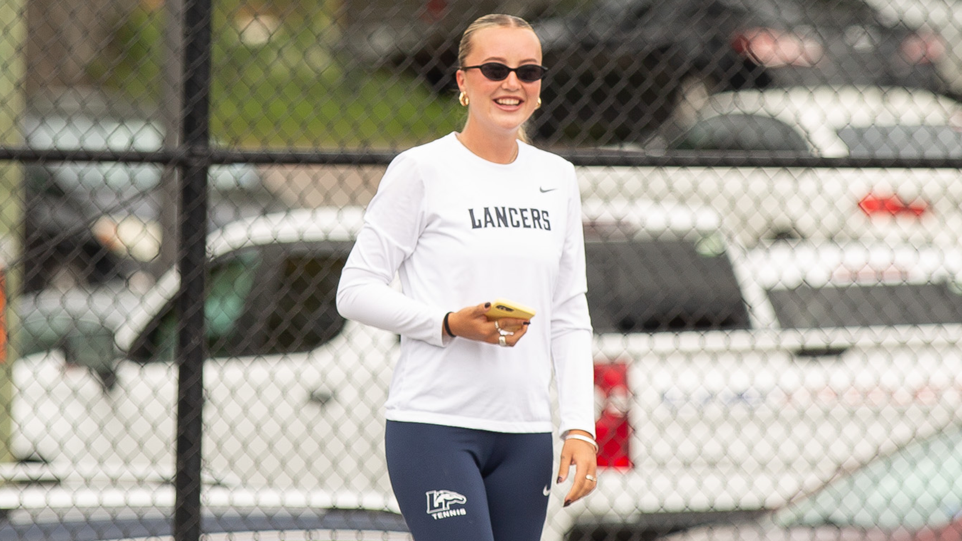Director of Tennis Charlotte Clarke smiles during a fall practice