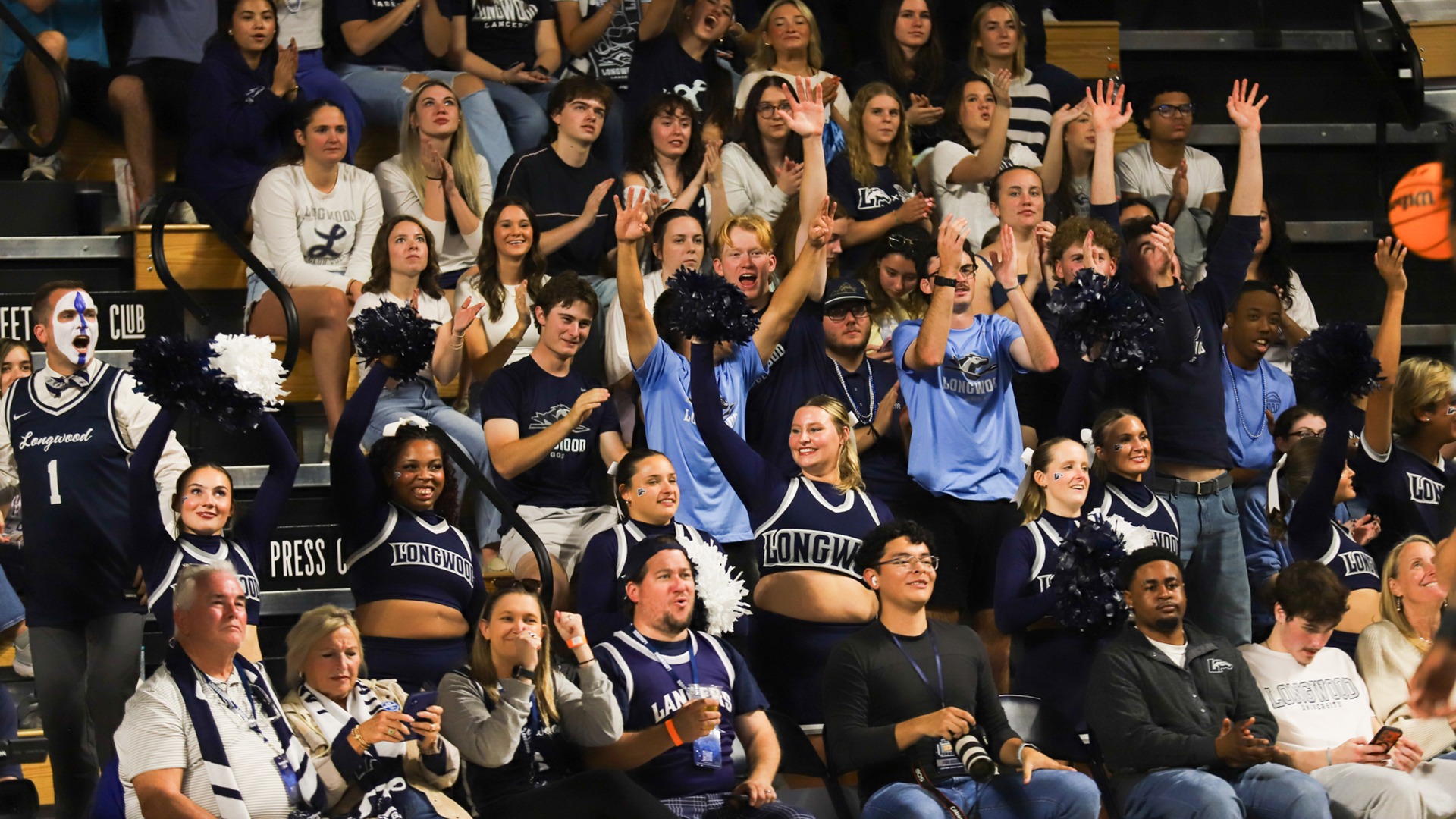 Baseline photo of the crowd with their arms up during the 2025 Homecoming Game. 